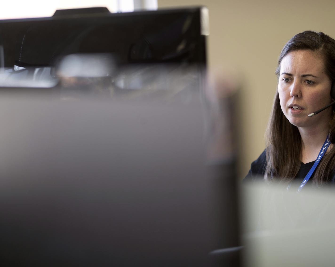 Natalie Sinkler, a child protection worker, took a call at an office in northeast Minneapolis.