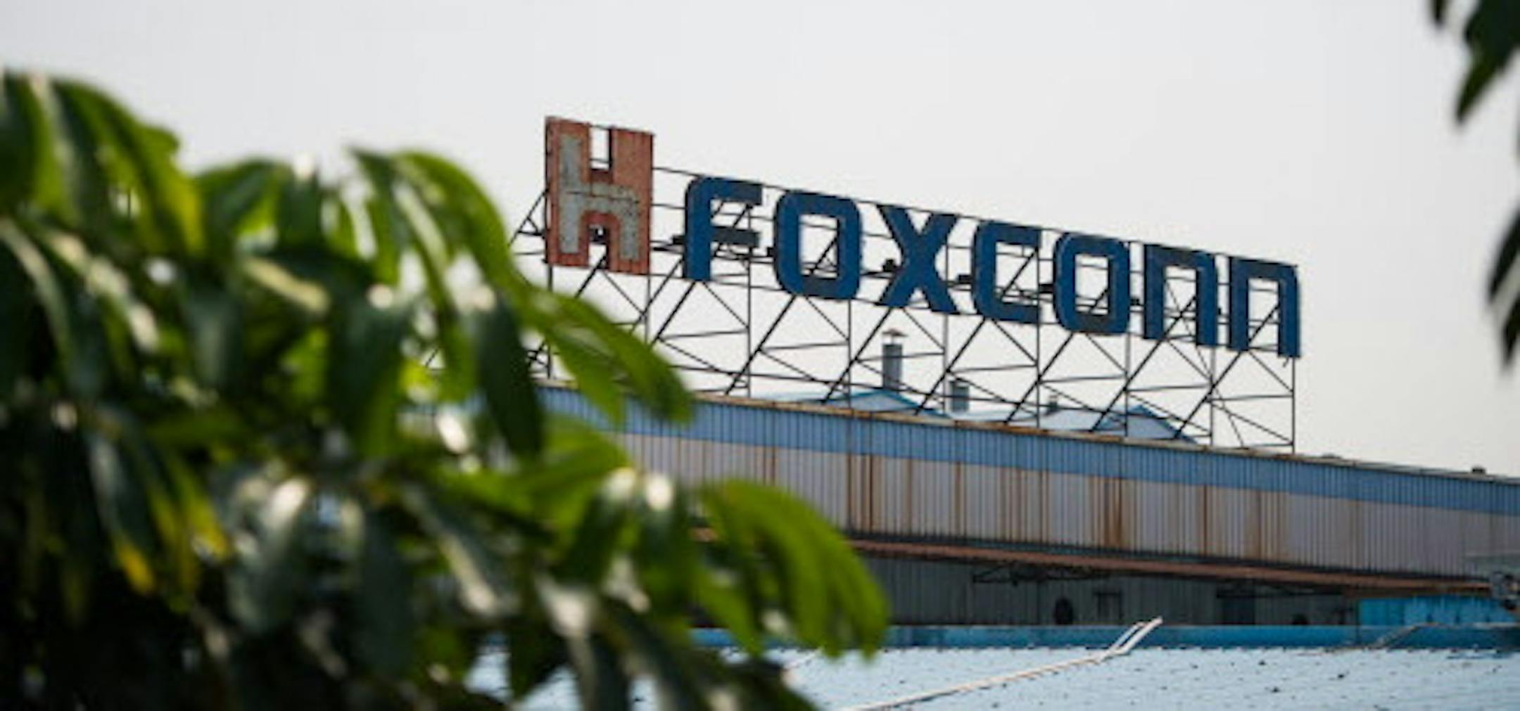 --FILE--View of a signboard of Foxconn at the plant of Foxconn of Hon Hai Precesion Industry in Longhua town, Shenzhen city, south China's Guangdong province, 16 April 2015. Affected by rising operational costs, some foreign enterprises operating in China are shifting their investment to other countries. Among them, Taiwan-headquartered Foxconn Technology (Hon Hai), the world's largest contract manufacturer of consumer electronics, is planning to invest 31 billion yuan (US$4.9 billion) in India.