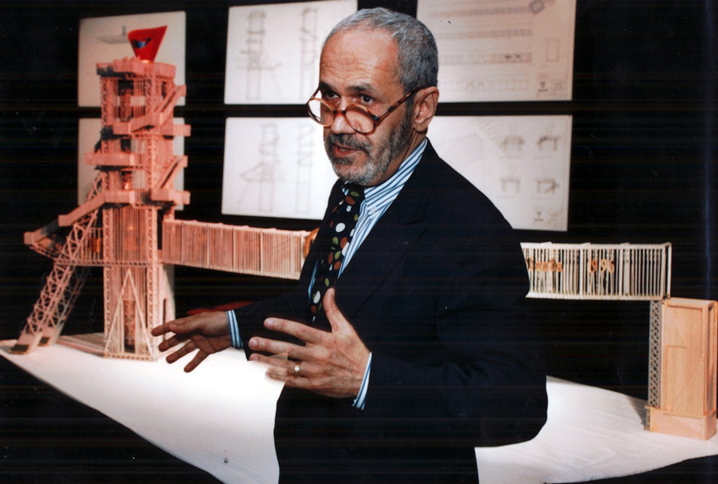 Siah Armajani in 1994 with a model for one of his biggest works, an Olympic torch cauldron and bridge for the Atlanta Summer Games. (Kimberly Smith/Atlanta Journal-Constitution)