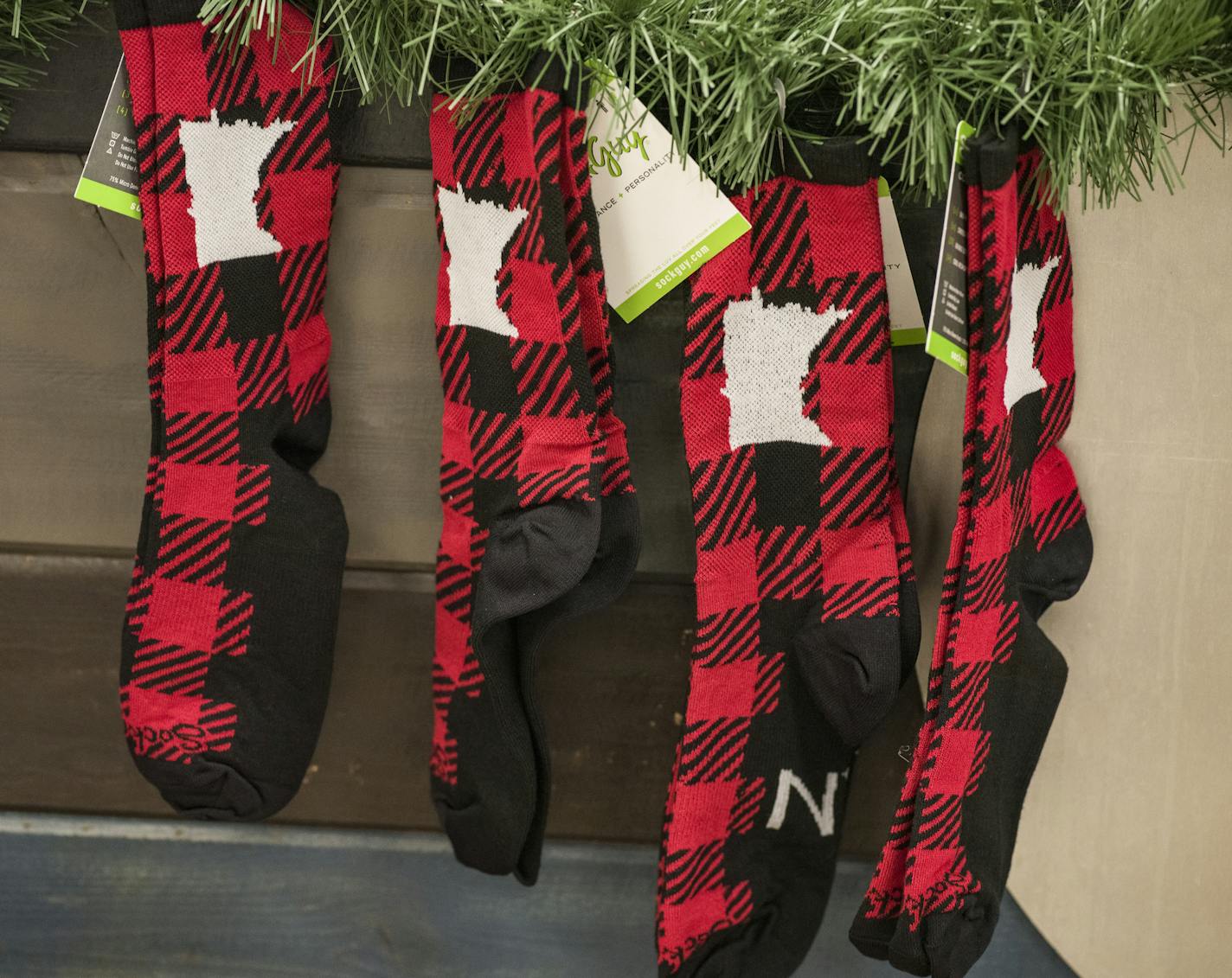 These lumber jack themed socks are popular items at the Beer Dabbler store. ] RICHARD TSONG-TAATARII &#x2022; richard.tsong-taatarii@startribune.com