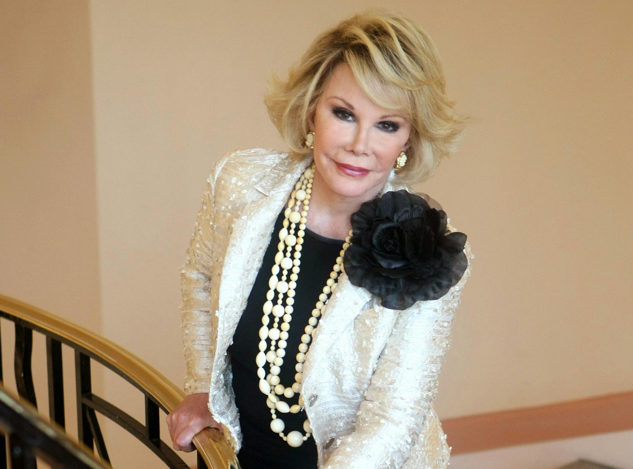 FILE - This Oct. 5, 2009 file photo shows Joan Rivers posing as she presents "Comedy Roast with Joan Rivers " during the 25th MIPCOM (International Film and Programme Market for TV, Video, Cable and Satellite) in Cannes, southeastern France. In October 1986, Rivers made TV history as the first woman hosting a late-night broadcast talk show. She was the first face of the Fox network, headlining its first program, "The Late Show Starring Joan Rivers." (AP Photo/Lionel Cironneau, File)