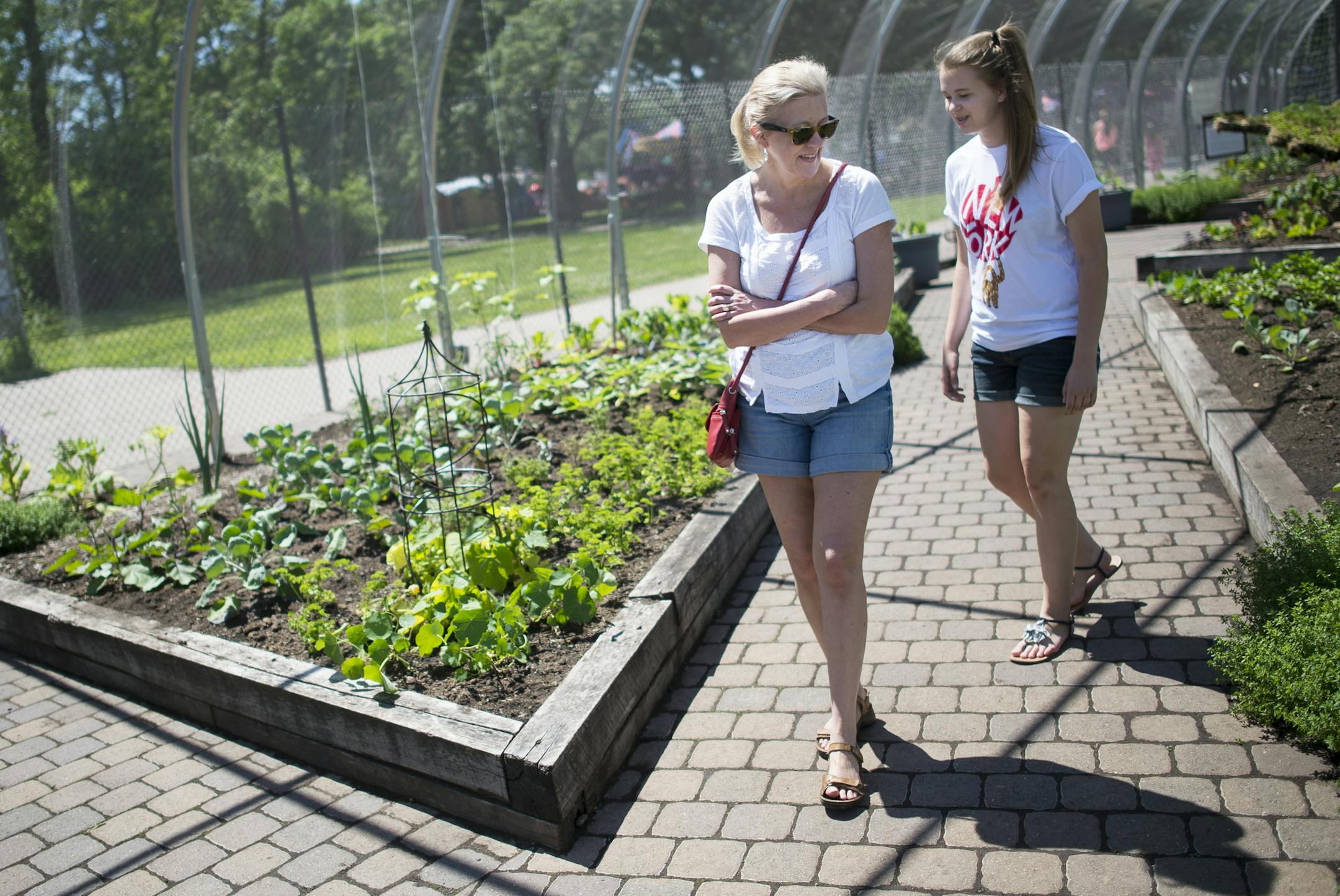 Lisa Bonko and her daughter Sammie, of St. Paul, walked through Como Zoo's Edible Garden, which opened Friday. ] Aaron Lavinsky &#x2022; aaron.lavinsky@startribune.com The edible garden at the Como Zoo opened on Friday, June 12, 2015 in St. Paul.