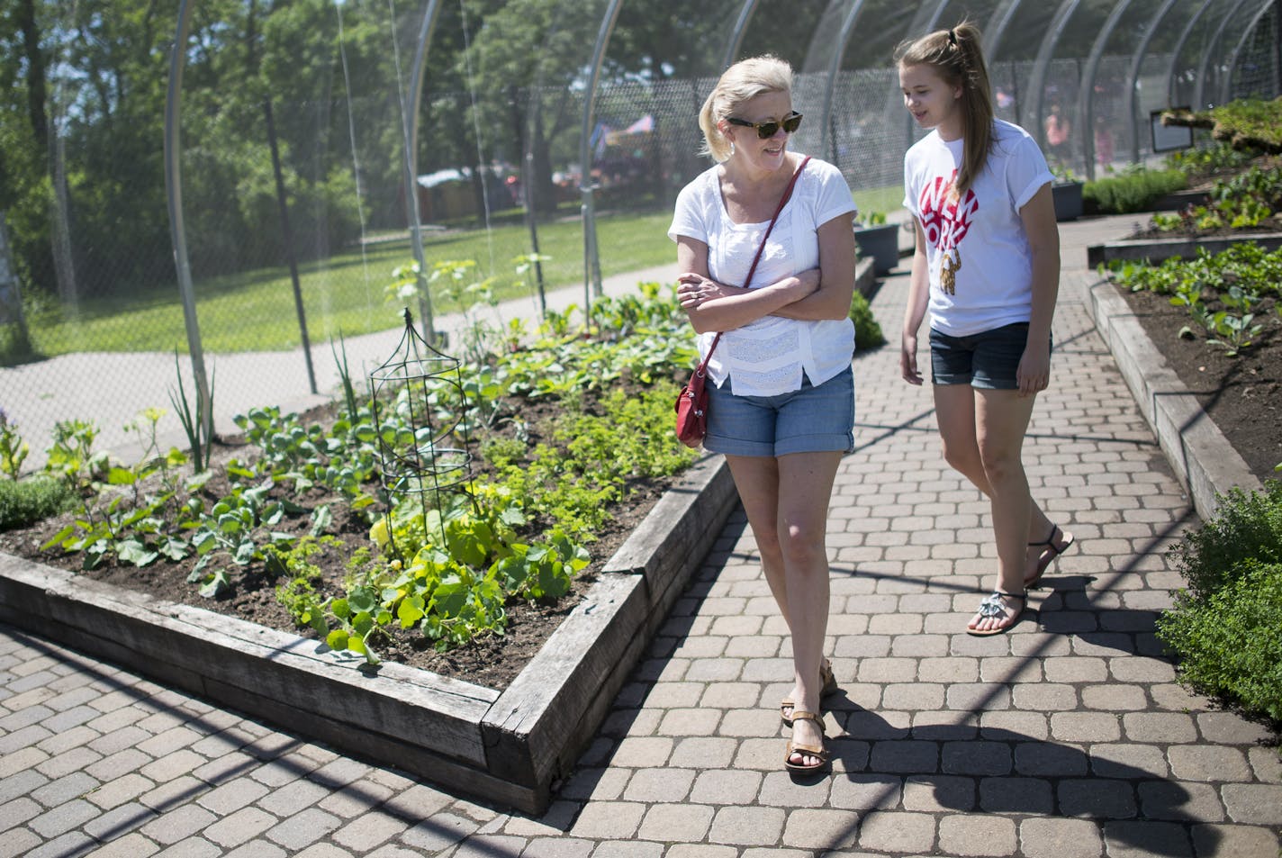 Lisa Bonko and her daughter Sammie, of St. Paul, walked through Como Zoo's Edible Garden, which opened Friday. ] Aaron Lavinsky &#x2022; aaron.lavinsky@startribune.com The edible garden at the Como Zoo opened on Friday, June 12, 2015 in St. Paul.