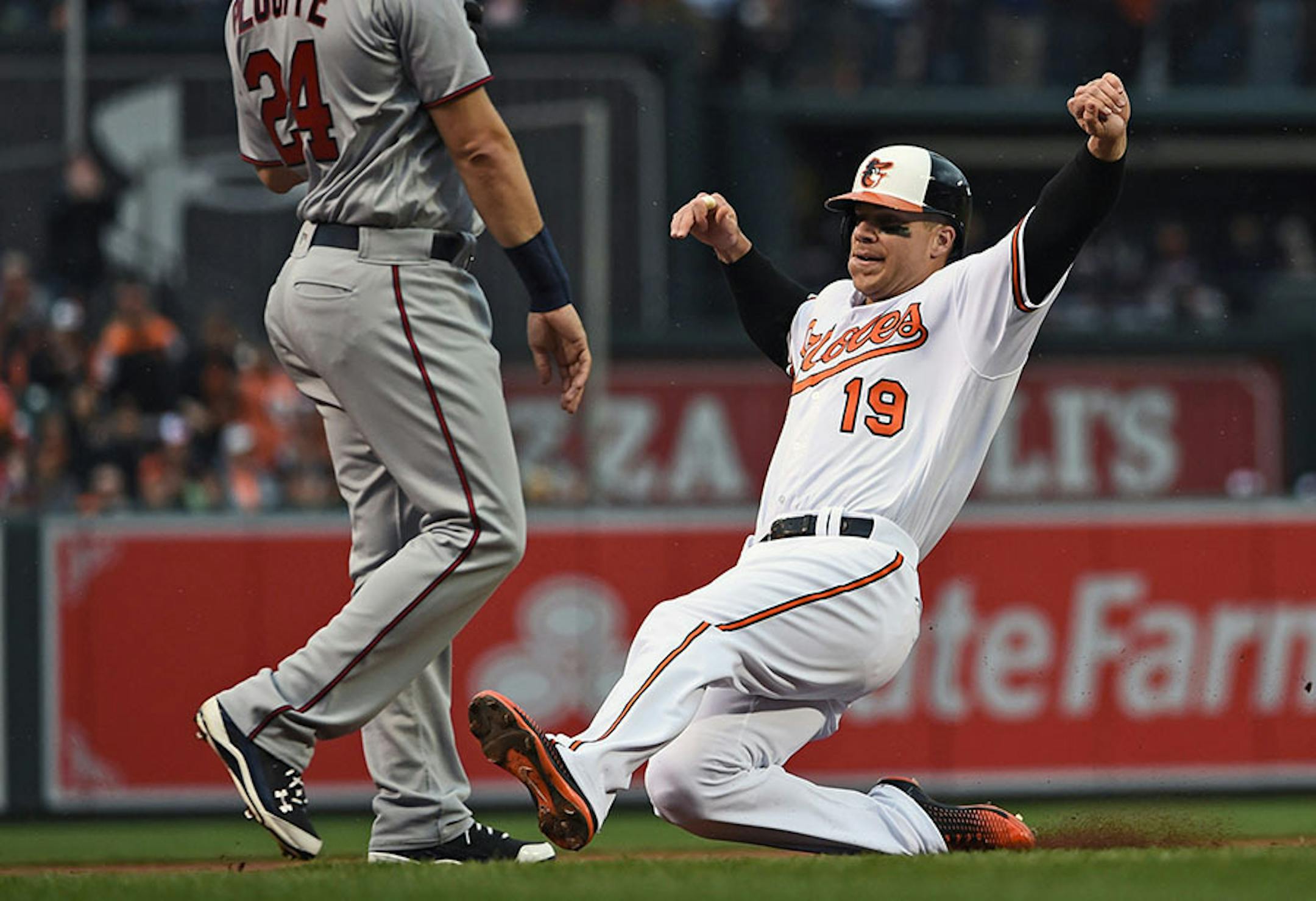 Baltimore Orioles' Chris Davis slides into third base on a single by Mark Trumbo on Monday, April 4, 2016, at Oriole Park at Camden Yards in Baltimore. (Kenneth K. Lam/Baltimore Sun/TNS) ORG XMIT: 1182892