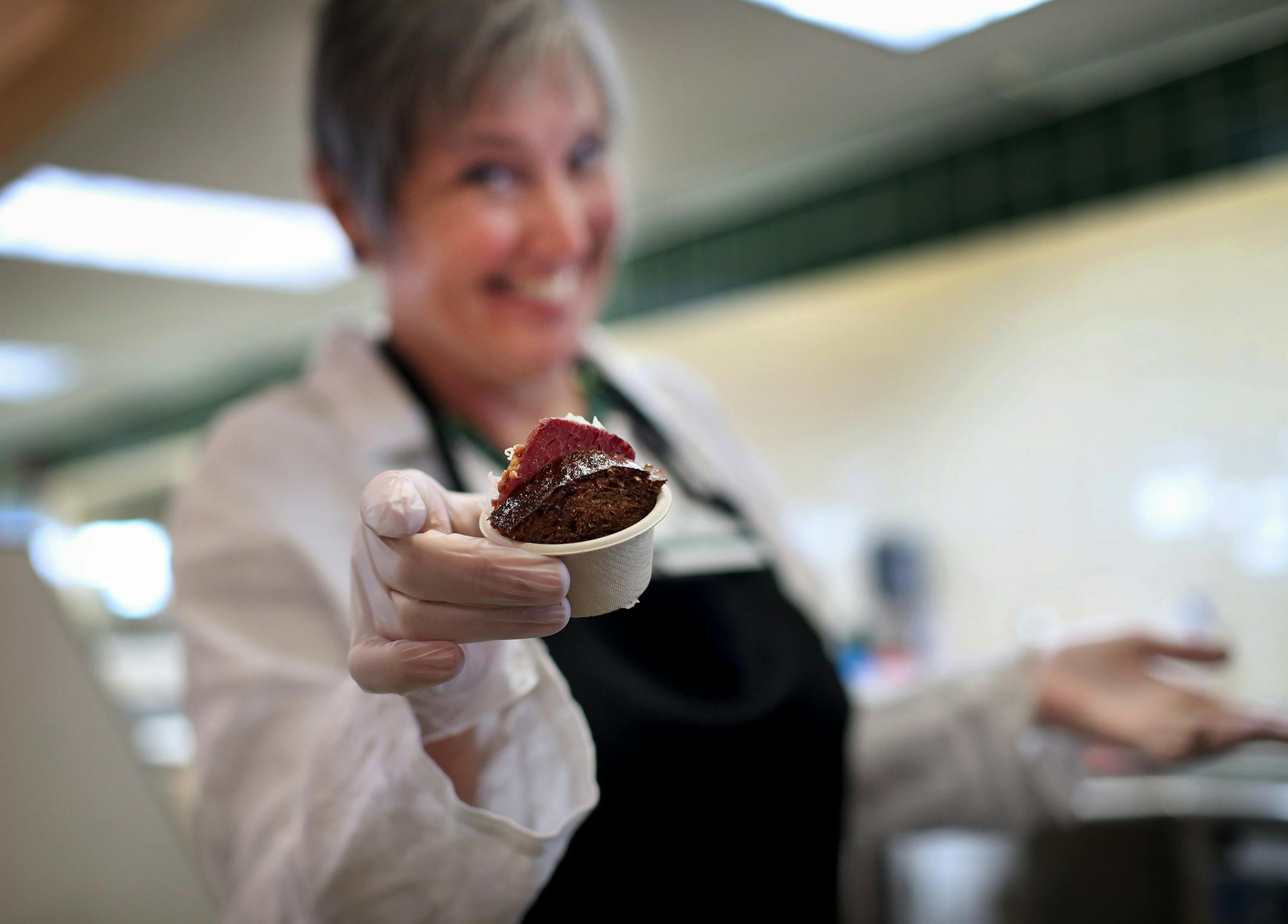 Kevyn Burger worked a shift at Lunds & Byerlys handing out samples of reuben sandwiches filled with Kobe corned beef.