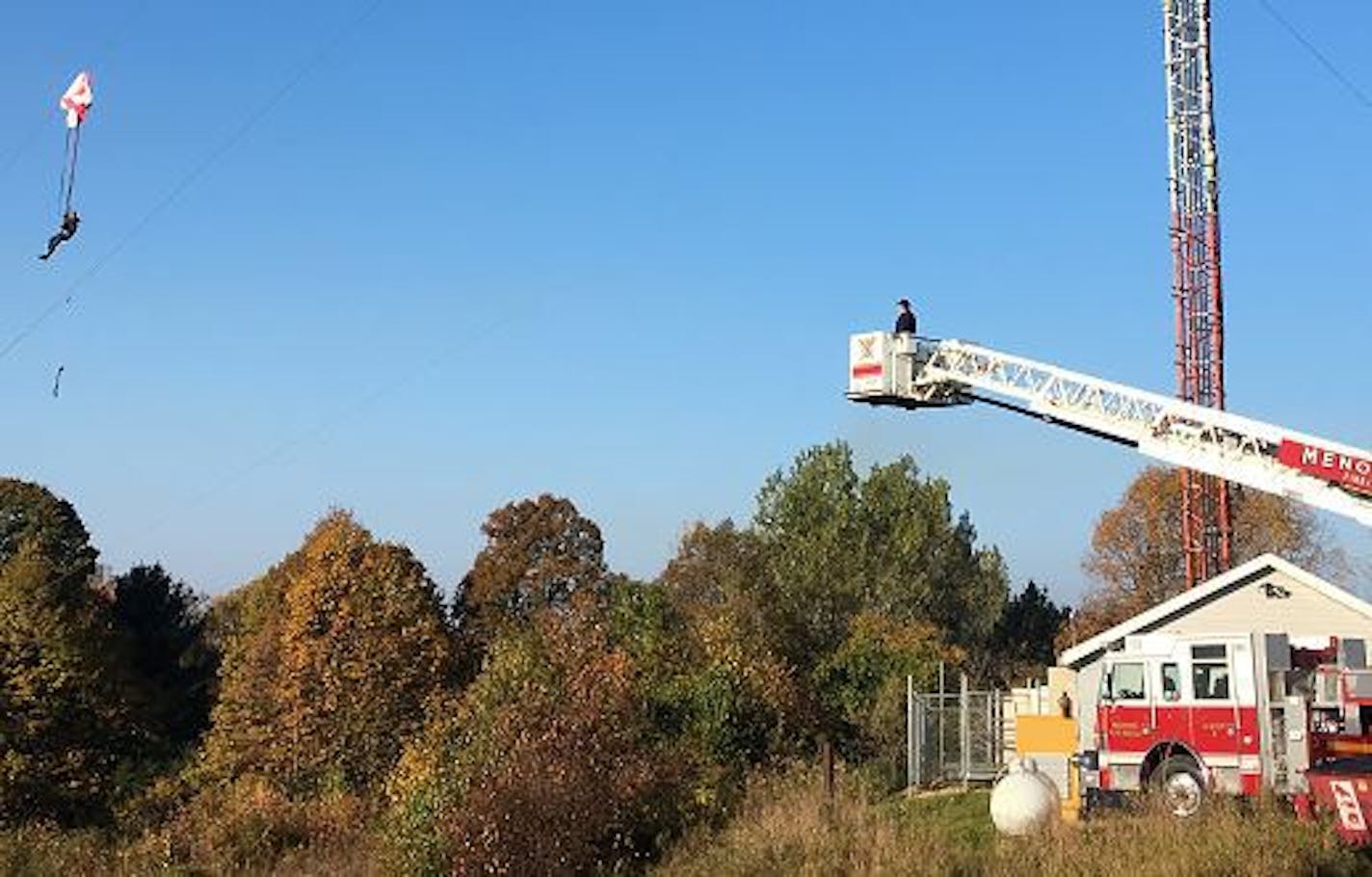 Mason Barth called 911 from 50 feet above ground after his parachute became entangled in the guy wire of the tower. Credit: Menomonie, Wis., police