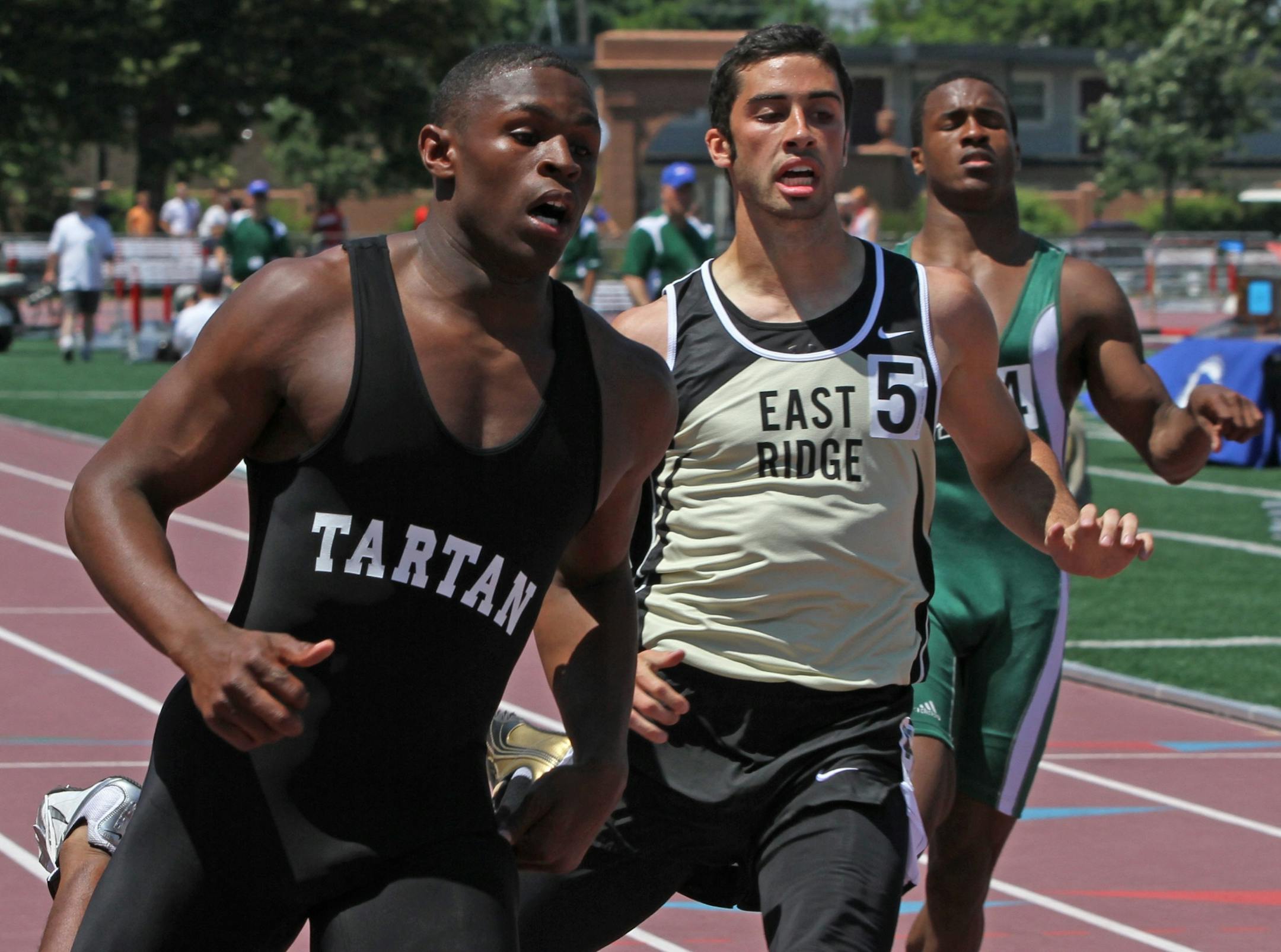 Tartan's Keelon Brookins (left) reportedly has decommitted from the Gophers football team and plans to go to Wisconsin.