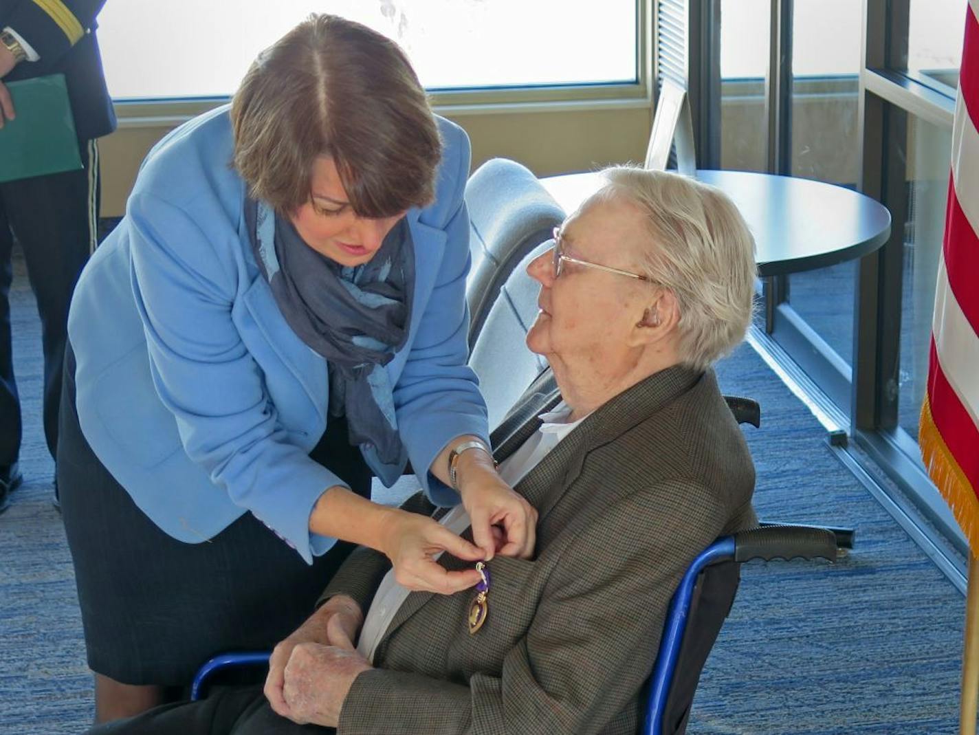 U.S. Senator Amy Klobuchar pinned a the Purple Heart on 93-year-old Minnesota World War II veteran Staff Sergeant Wayne Sundberg at the Veterans Services Building St. Capitol complex on Wed., Dec. 27, 2017. MANDATORY CREDIT: