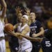 Minnesota Gophers guard Carlie Wagner (33) was fouled by Xavier Musketeers guard Princess Stewart (5) as she drove to the net in the first quarter.