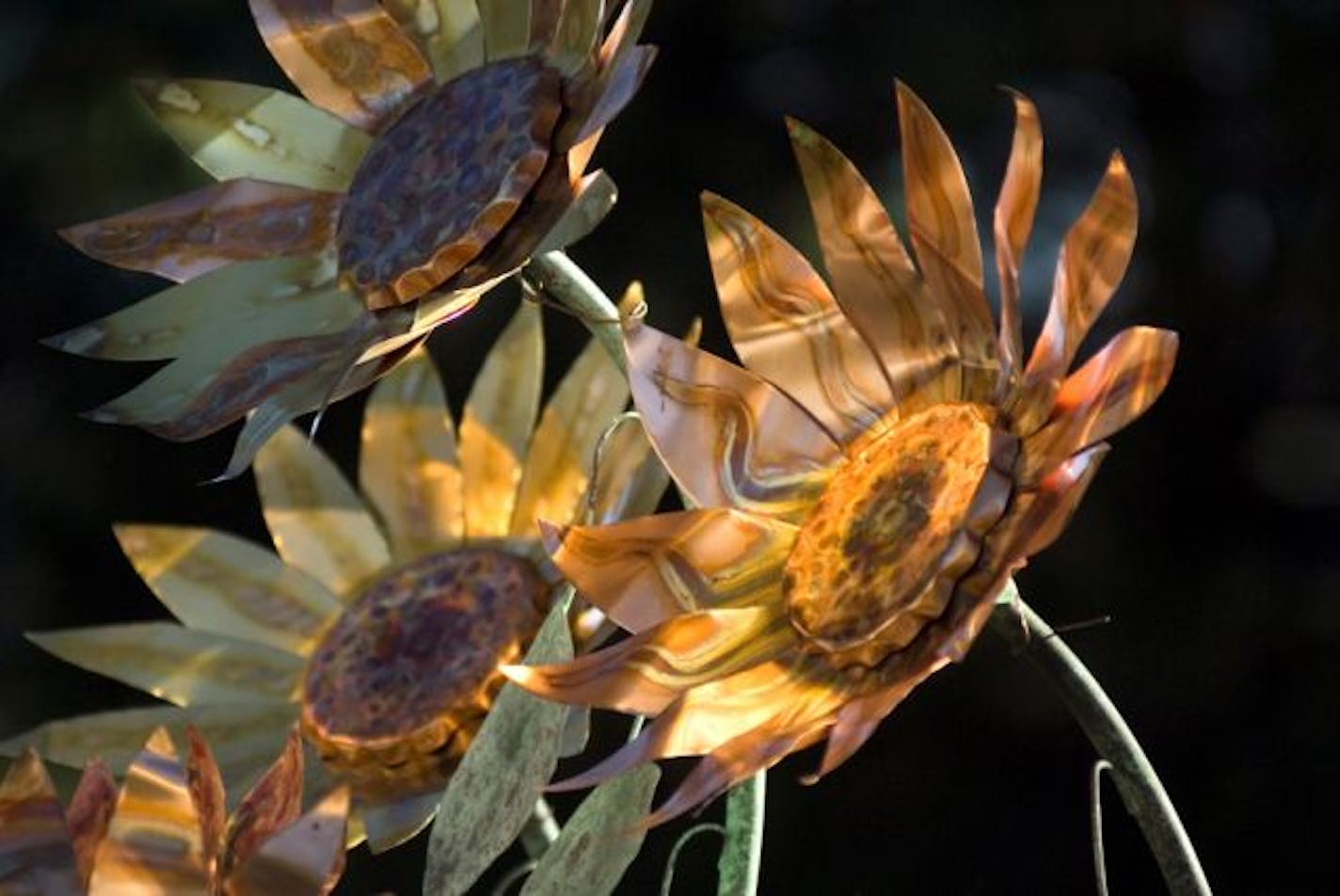 Sunflower sculpture in copper and brass by Alex Zaves, who will be at the Loring Park Art Festival.