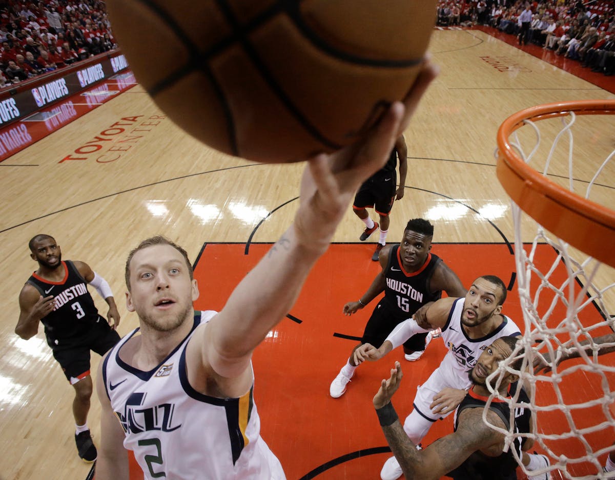 Jazz forward Joe Ingles drives to the basket during the first half