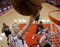 Jazz forward Joe Ingles drives to the basket during the first half