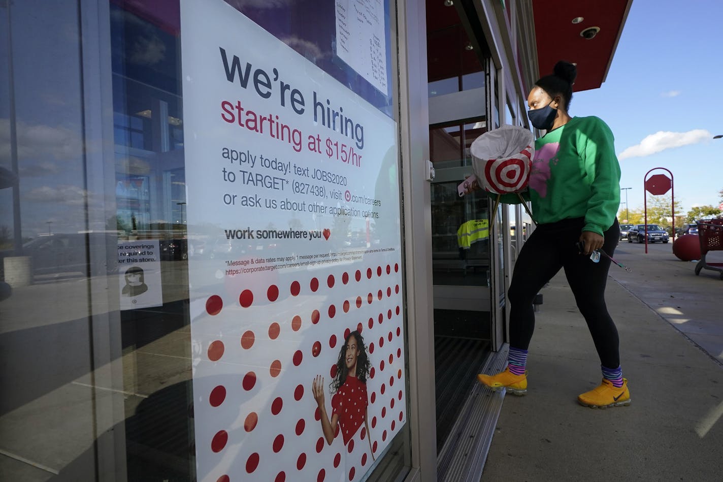 Target is going to give 350,000 of its hourly employees another $200 bonus because of the pandemic. Shown is a Target store in Westwood, Mass. (AP Photo/Steven Senne, File)