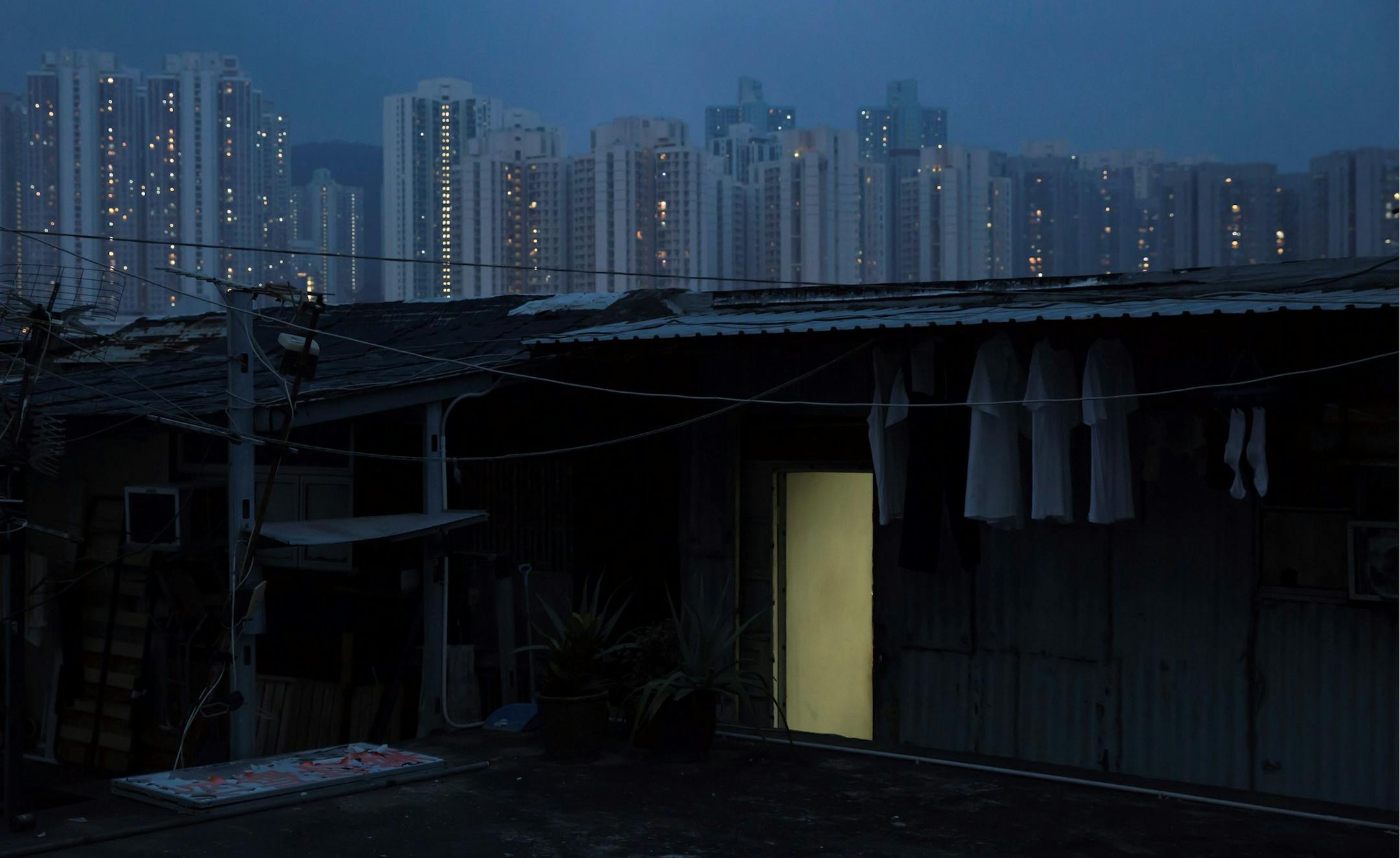 In this Saturday, May 6, 2017 photo, an illegal rooftop hut is seen in Hong Kong. There&#xed;s a dark side to the property boom in wealthy Hong Kong, where hundreds of thousands of people priced out of the market must live in partitioned apartments, &#xec;coffin homes&#xee; and other inadequate housing. As a new leader for the territory prepares to take office, housing unaffordability remains one of the Asian financial center&#xed;s biggest social problems.(AP Photo/Kin Cheung) ORG XMIT: XKC120