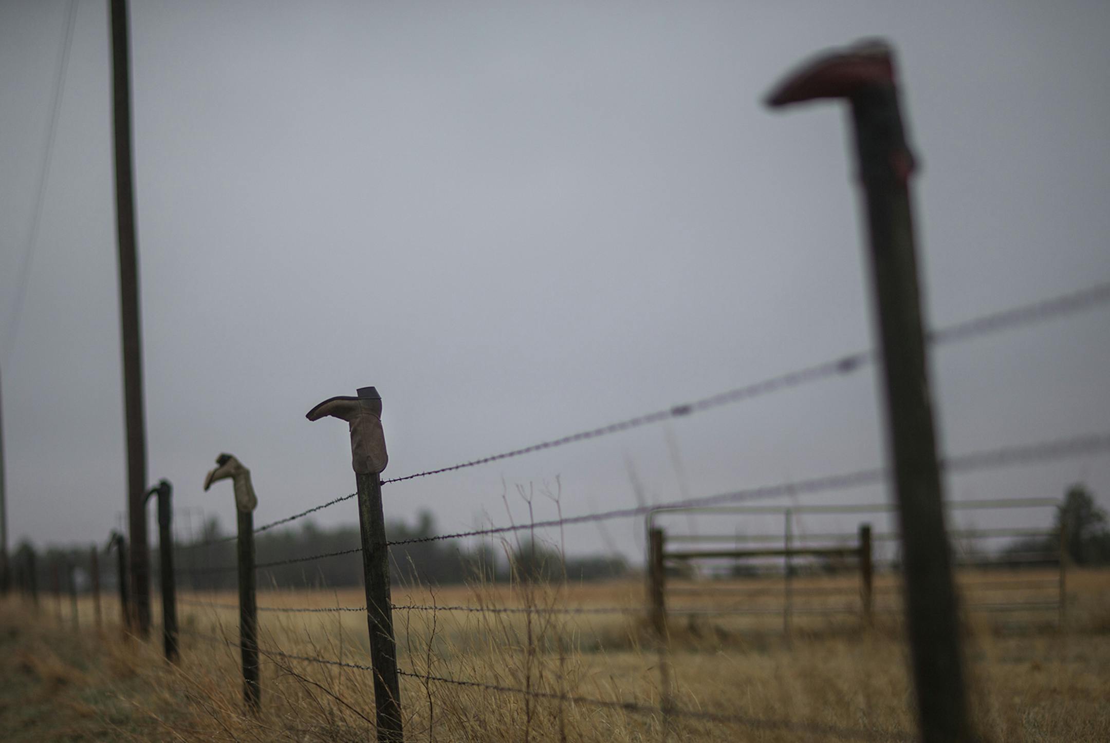 Old boots top fence posts in Ainsworth, Neb., April 6, 2015. The laws giving nurse practitioners greater autonomy have been particularly important in rural states like Nebraska, which struggle to recruit doctors to remote areas.