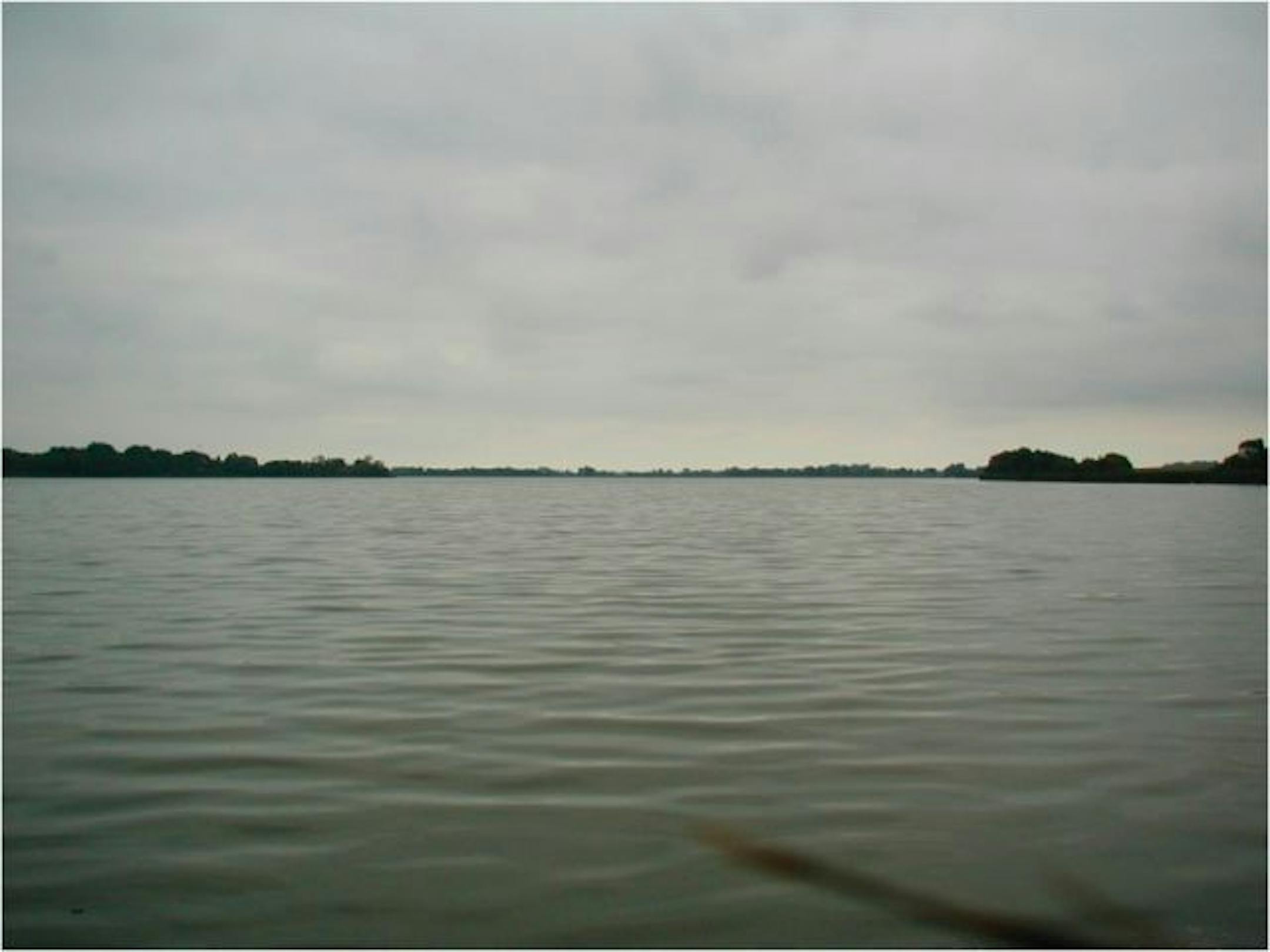 A dirty, open 400-acre slough, Lake Maria is shown before it was restored.