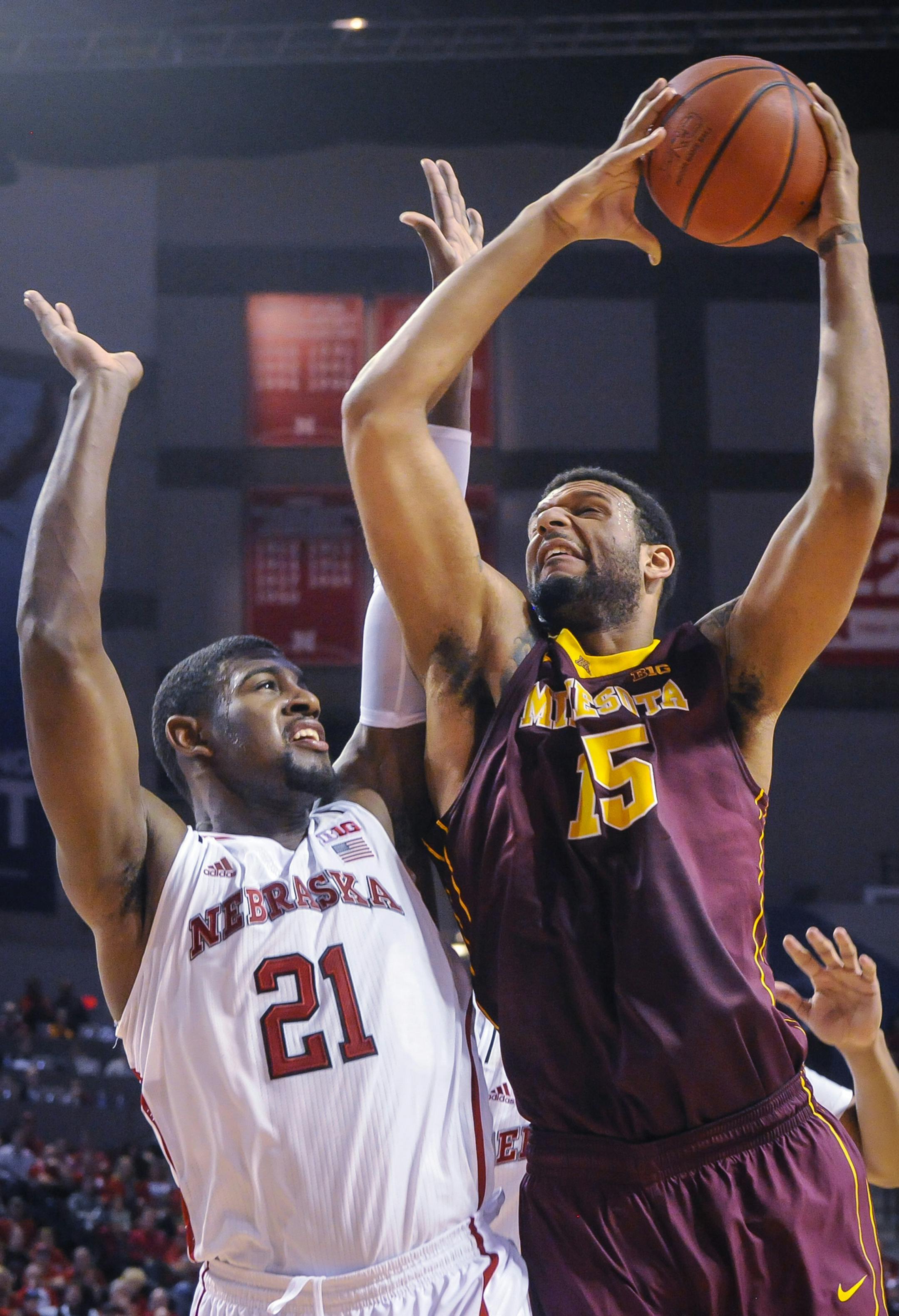Minnesota Golden Gophers forward Maurice Walker (15) shoots the ball over Nebraska Cornhuskers forward Leslee Smith (21) during their Sunday, Jan 26, 2014 NCAA basketball game at the Pinnacle Bank Arena in Lincoln, Neb. (AP Photo/Dave Weaver)