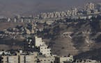 FILE &#xf3; The Israeli settlement of Maale Adumim overlooks Al Z&#xed;aim, a Palestinian village in the West Bank, Oct. 26, 2016. Since the election 