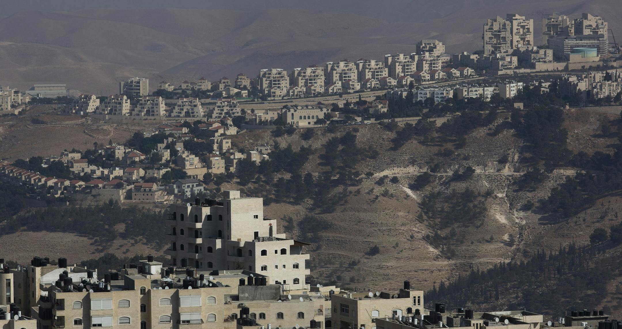 FILE ó The Israeli settlement of Maale Adumim overlooks Al Zíaim, a Palestinian village in the West Bank, Oct. 26, 2016. Since the election of Donald Trump, pro-settlement Israeli politicians have pushed for legislation retroactively legalizing outposts on privately owned Palestinian land. (Rina Castelnuovo/The New York Times) ORG XMIT: MIN2016122622232366