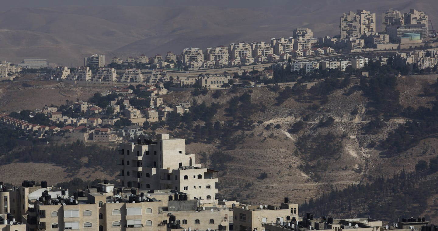 FILE &#xf3; The Israeli settlement of Maale Adumim overlooks Al Z&#xed;aim, a Palestinian village in the West Bank, Oct. 26, 2016. Since the election of Donald Trump, pro-settlement Israeli politicians have pushed for legislation retroactively legalizing outposts on privately owned Palestinian land. (Rina Castelnuovo/The New York Times) ORG XMIT: MIN2016122622232366