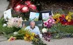 Flowers and mementos adorned a makeshift memorial honoring the late golf great Arnold Palmer at Palmer's parking spot at the Golf Channel studios in O
