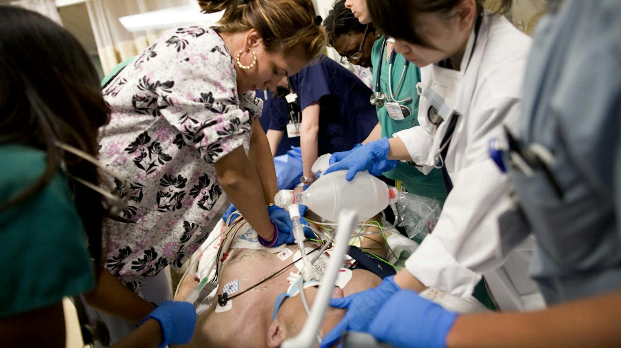 Dr. Kim-Tan Nguyen, right, tries to help revive an urgent-care patient at Maimonides Medical Center in New York.