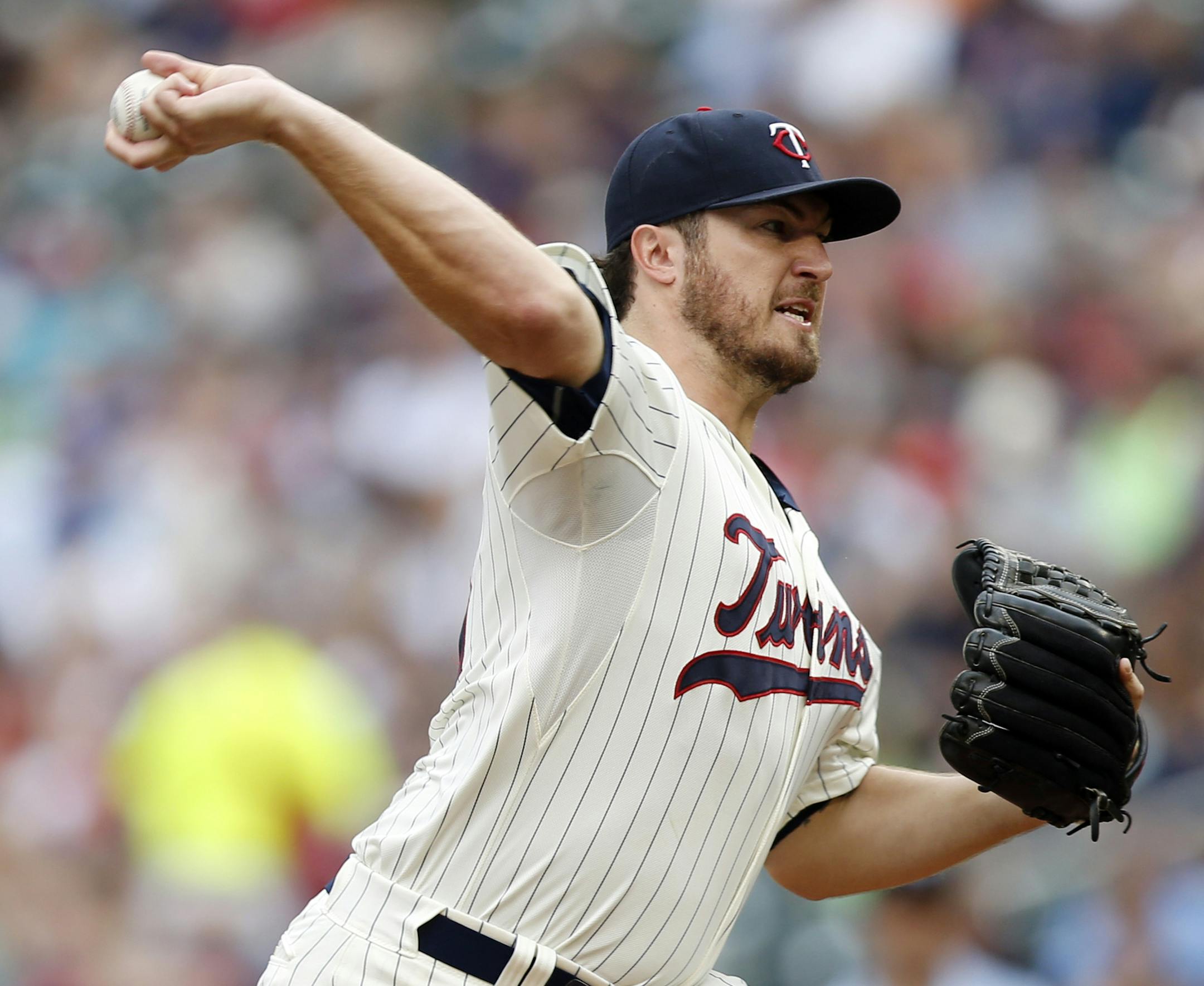 Minnesota Twins pitcher Phil Hughes throws against the Detroit Tigers in the first inning of a baseball game, Saturday, July 11, 2015, in Minneapolis. (AP Photo/Jim Mone)
