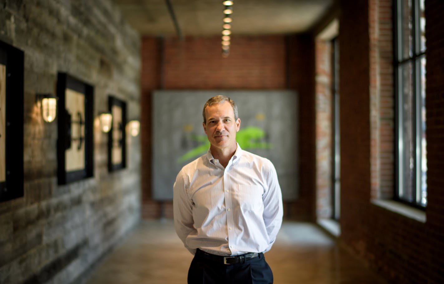 Arctic Cat CEO Chris Metz in the company's new Headquarters in North Loop Minneapolis. The building is the renovated and expanded site of the Western Container building. ] GLEN STUBBE * gstubbe@startribune.com Tuesday, August 16, 2016 Arctic Cat CEO Chris Metz showed off the company's new Headquarters in North Loop Minneapolis. The building is the renovated and expanded site of the Western Container building.