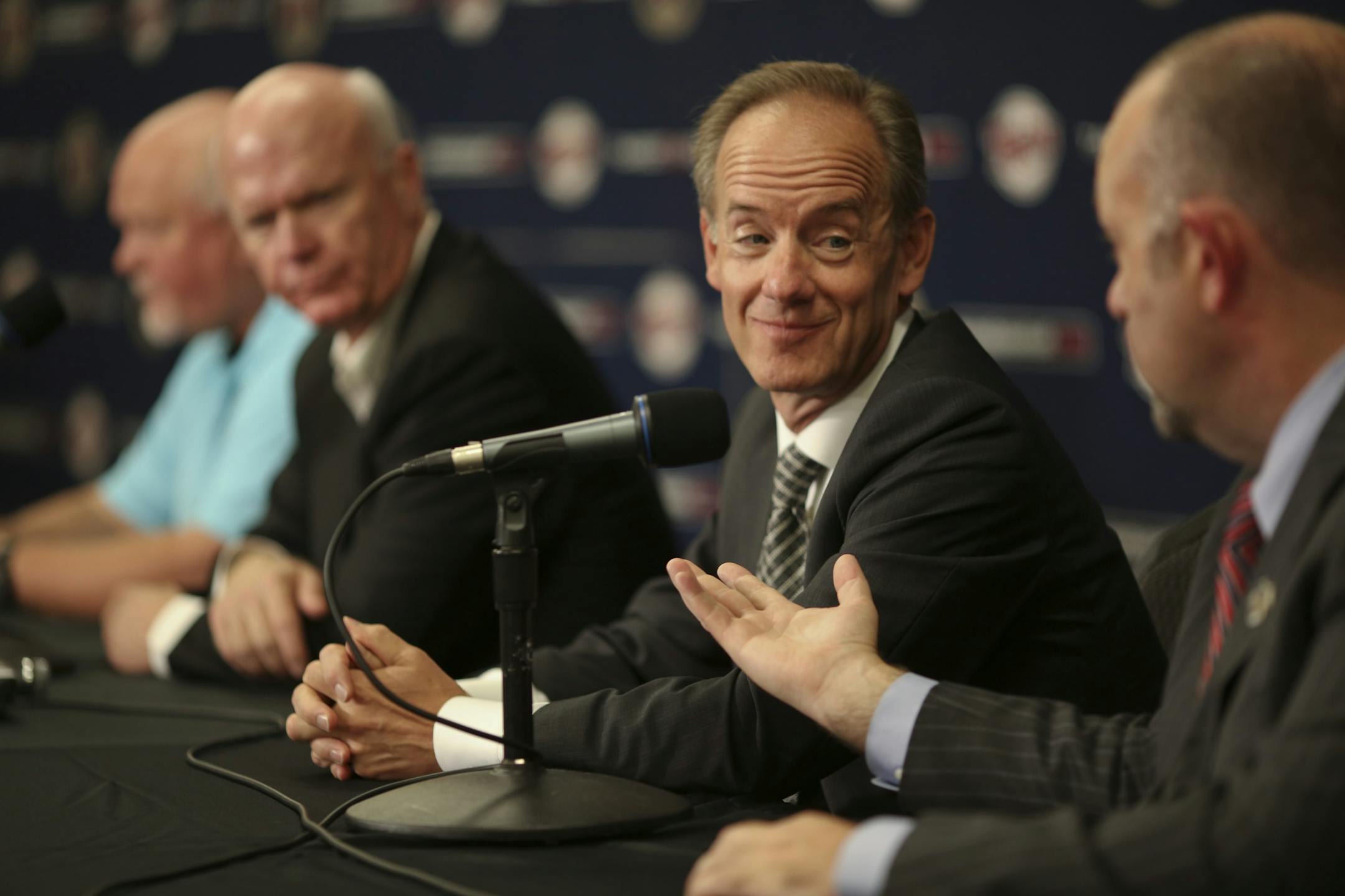 Twins President Dave St. Peter, foreground, offered Twins CEO Jim Pohlad the chance to answer a question at a news conference announcing a contract extension for Ron Gardenhire.