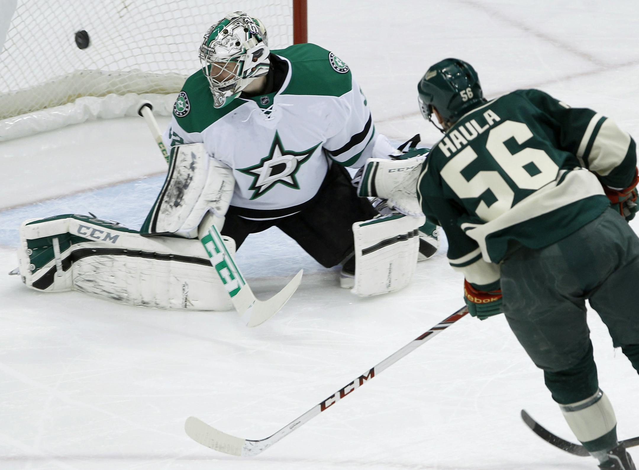 A shot by Minnesota's Erik Haula (56) gets past Dallas goalie Kari Lehtonen.