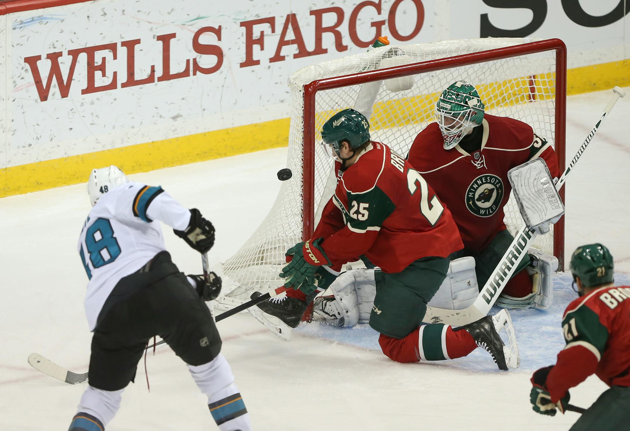 San Jose Sharks center Tomas Hertl (48) had a second period shot hit the pipe while the Wild's Jonas Brodin (25) defended and goalie Josh Harding (37) kept his then-shutout intact.