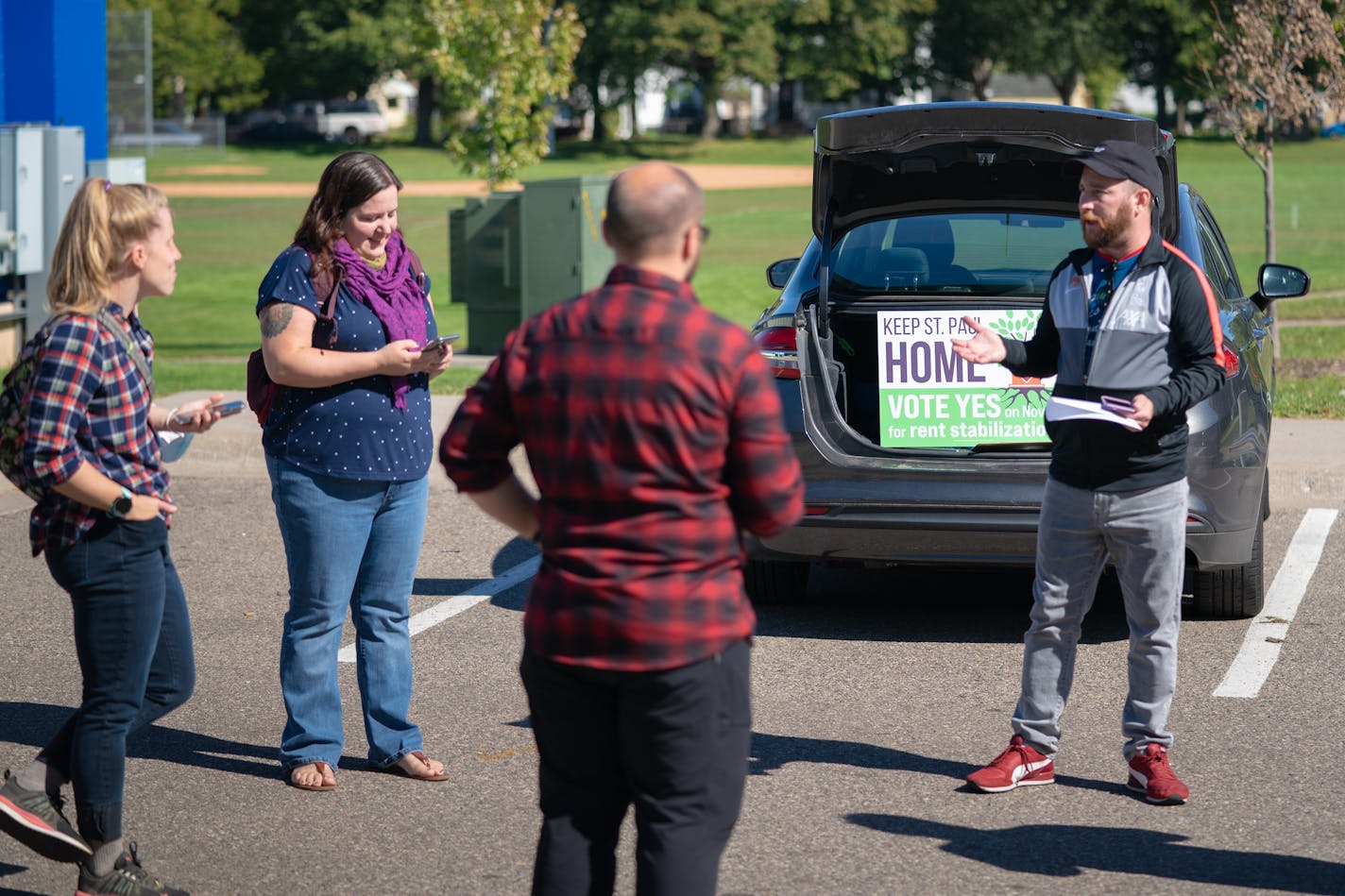 Volunteer coordinator David Zeller with the advocacy group, Keep St. Paul Home, worked with a group of volunteers, training them to go out in St. Paul neighborhoods, urging residents to vote YES for rent stabilization on the November 2 election. He then handed out literature for the volunteers to distribute.