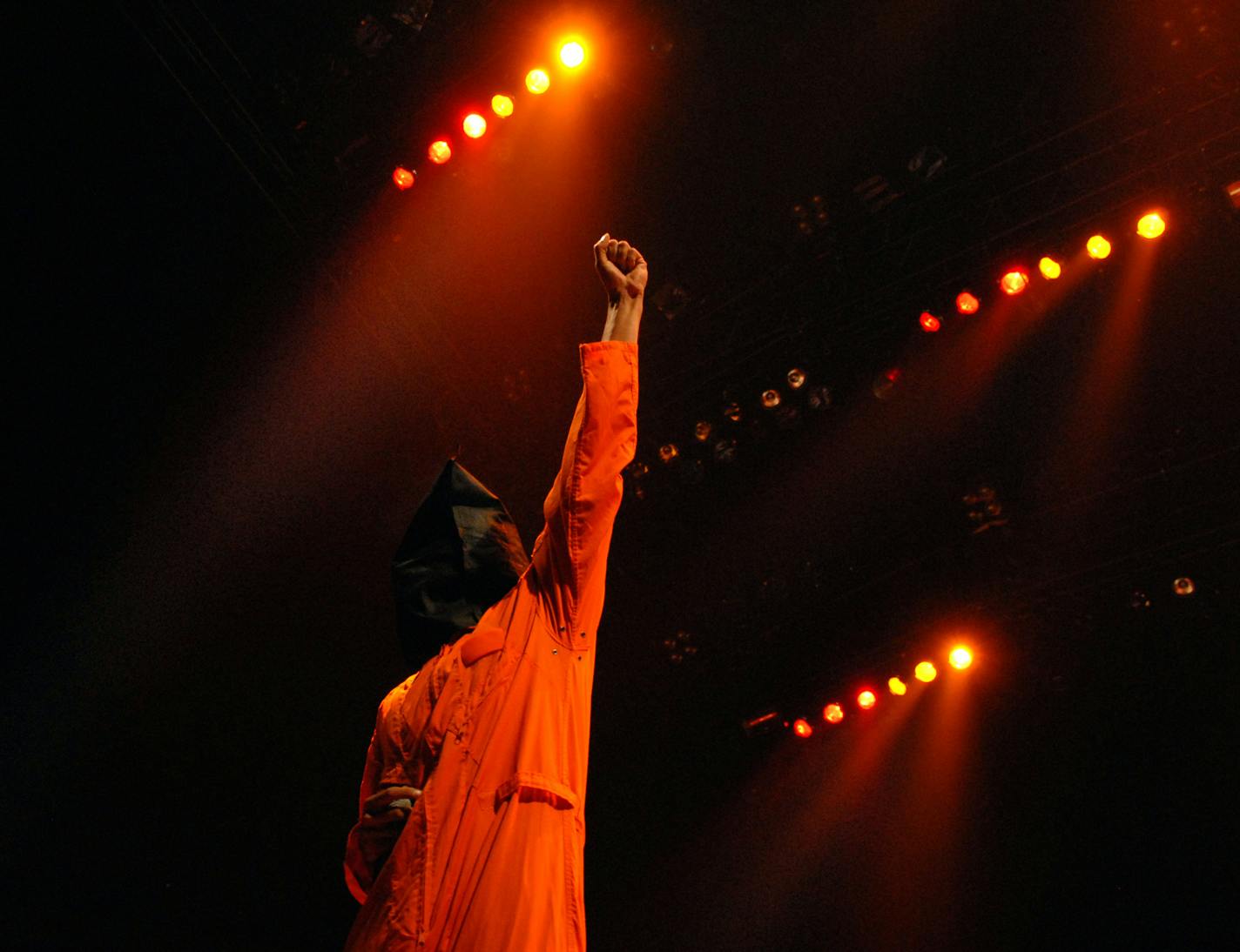 Members of Rage Against the Machine came out wearing hoods and Guantanamo Bay prisoner suits to start their Target Center concert Wednesday night. This is lead singer Zack de la Rocha.