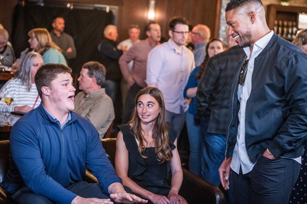 Notre Dame coach Marcus Freeman, right, was among 100 friends and family members supporting Joe Alt on Thursday night during the first round of the NFL draft. 