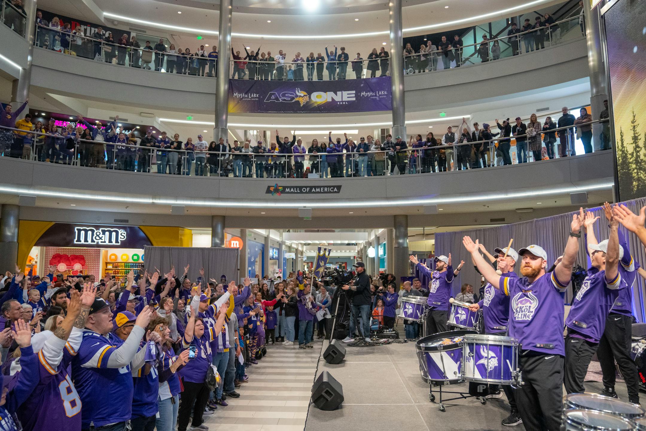 The Minnesota Vikings Skol Line leads the crowd in a "skol" chant during a Vikings fan rally.