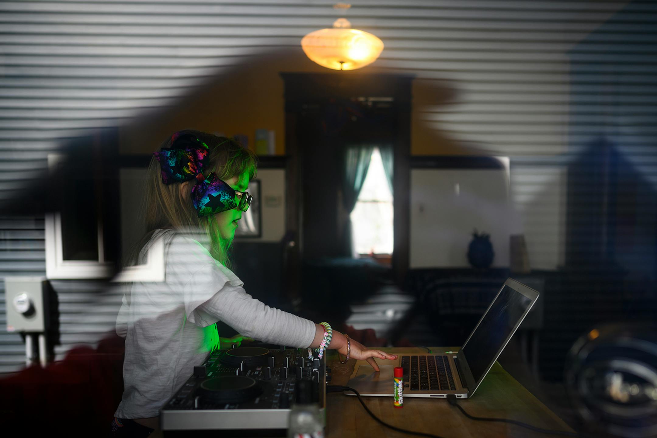 Mirabel DeCelle-Burback, 7, played with her parents' sound equipment while doing some at-home DJing in late April. "I like dancing and my mom and my dad are DJs so I figure I'd try it out!" exclaimed Mirabel.