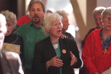 Sister Rita McDonald singing with other protesters at the Hennepin County Government Center in 1997, after 78 land-mine protesters were found guilty o