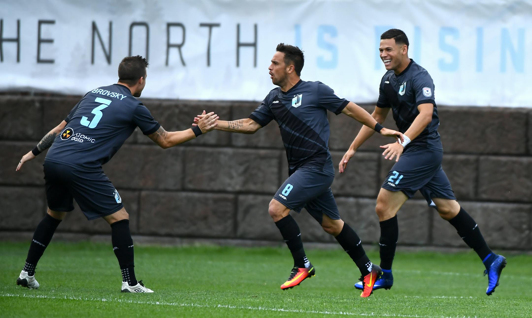Minnesota United FC defender Jeb Brovsky (3), forward Danny Cruz (8) and forward Christian Ramirez (21) celebrated a penalty kick by Ramirez early in the first half Saturday. ] (AARON LAVINSKY/STAR TRIBUNE) aaron.lavinsky@startribune.com Minnesota United F.C. played the Indy Eleven on Saturday, July 16, 2016 at the National Sports Center in Blaine, Minn.