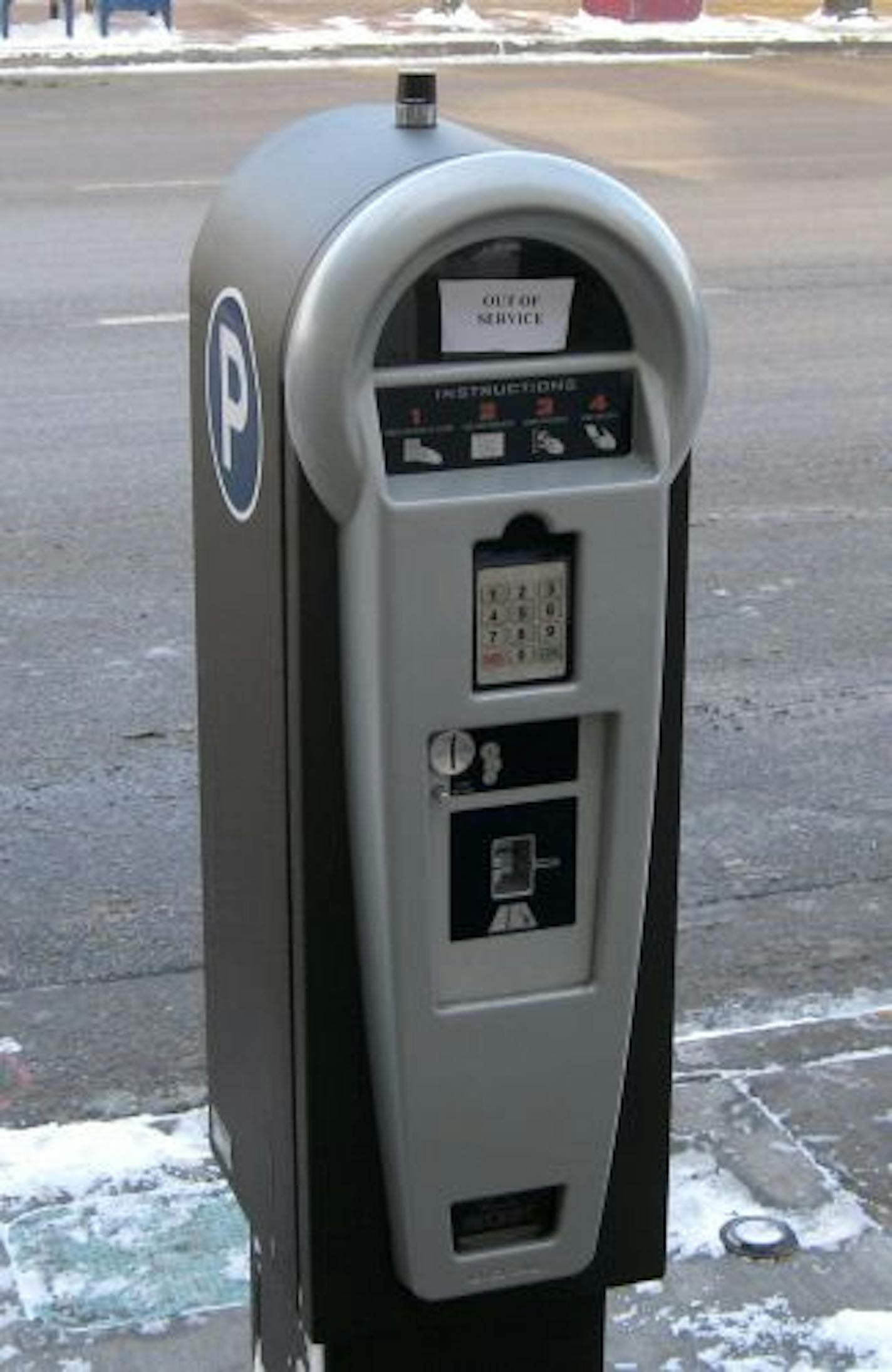 A new multi-space parking meter being tested on SE. 4th St. in Dinkytown, Minneapolis. It wasn't yet in service on Thursday, but it's designed to take credit cards and coins. The one across the street has a solar panel on top. photo by Jim Foti Roadguy1228