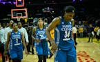 Lynx players, including forward Maya Moore, walk back to the locker room following a 75-64 loss against the Los Angeles Sparks in Game 3 of the WNBA F