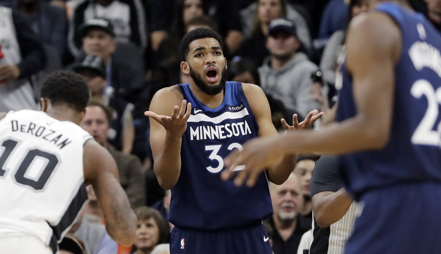 Minnesota Timberwolves forward Karl-Anthony Towns (32) reacts after he was called for his sixth foul during the second half of an NBA basketball game against the San Antonio Spurs, Wednesday, Oct. 17, 2018, in San Antonio. San Antonio won 112-108. (AP Photo/Eric Gay)