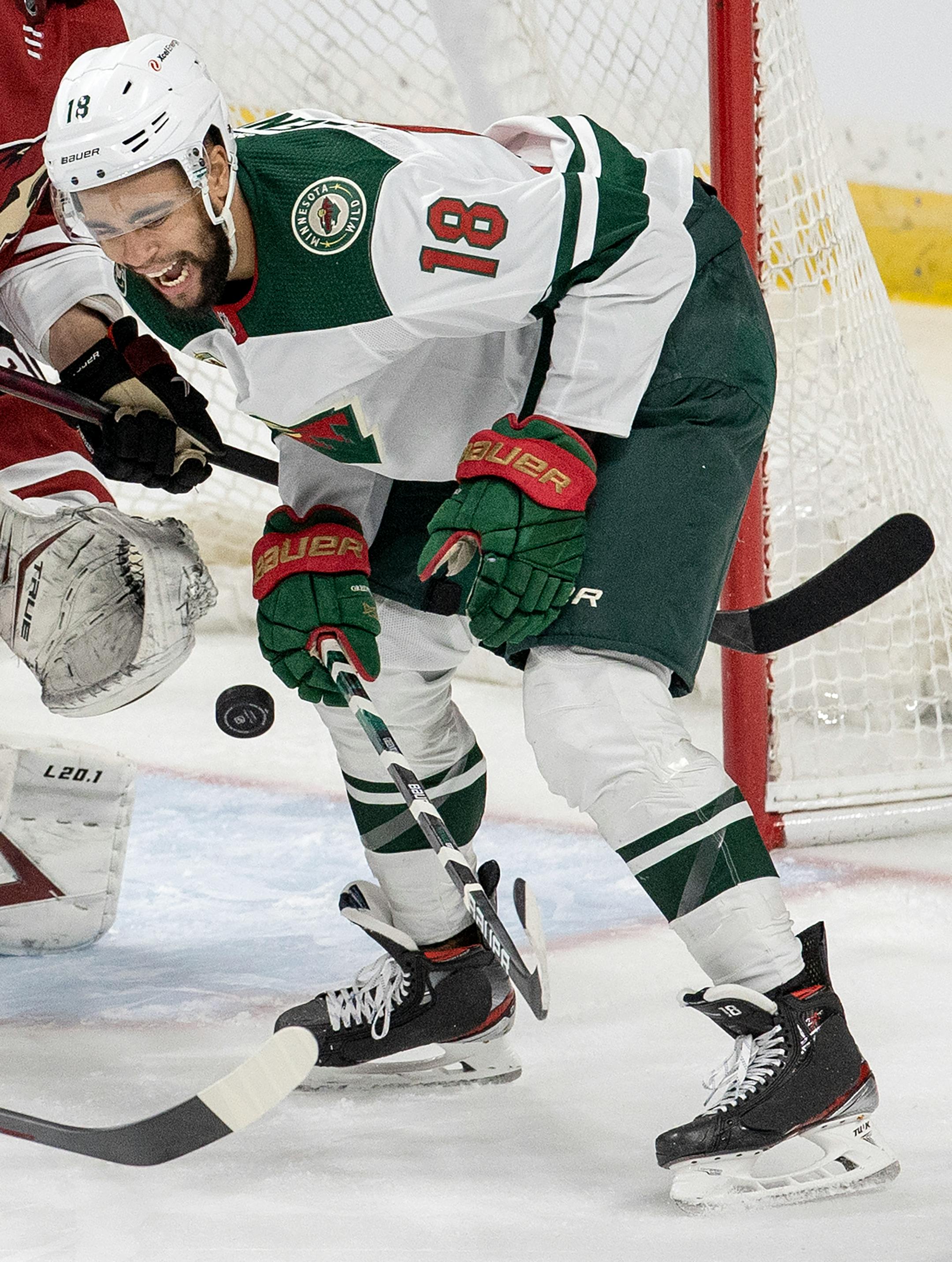 Jordan Greenway (18) of the Minnesota Wild was hit by a puck in the second period.