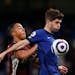 Leicester's Youri Tielemans, left, duels for the ball with Chelsea's Christian Pulisic