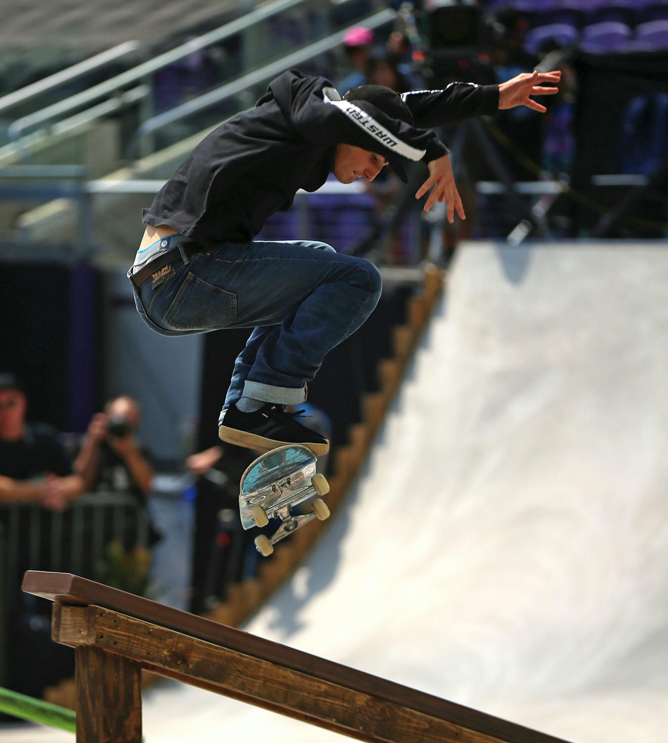 Vincent Milou pulls off a trick in the men's skateboard street final.