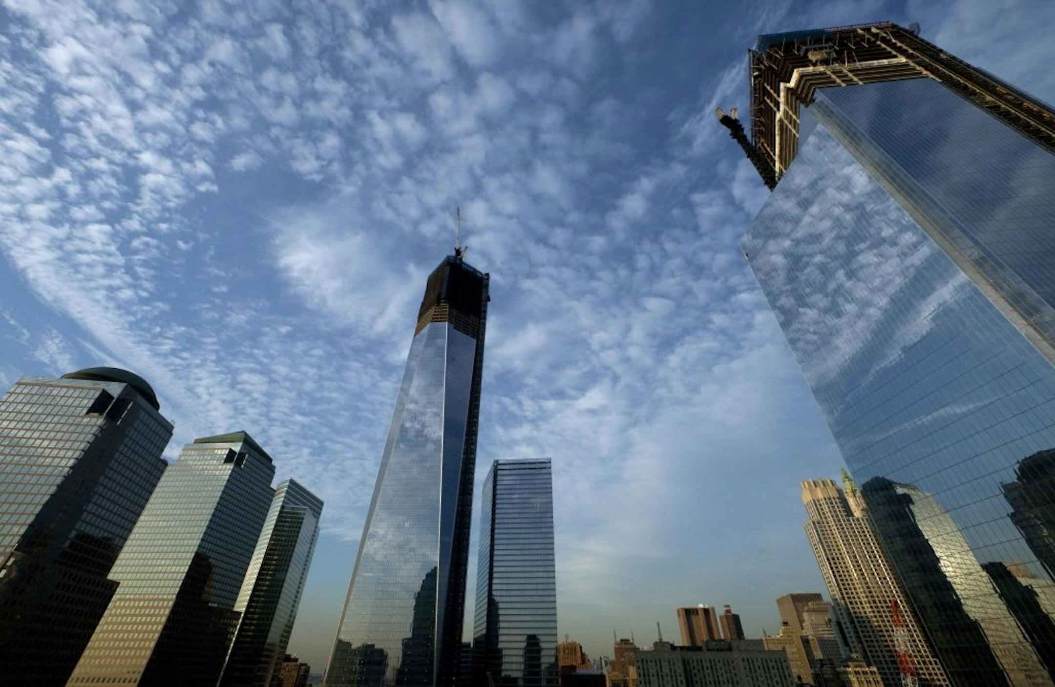 One World Trade Center, center, rises above the National September 11 Memorial and Museum at the World Trade Center in New York.