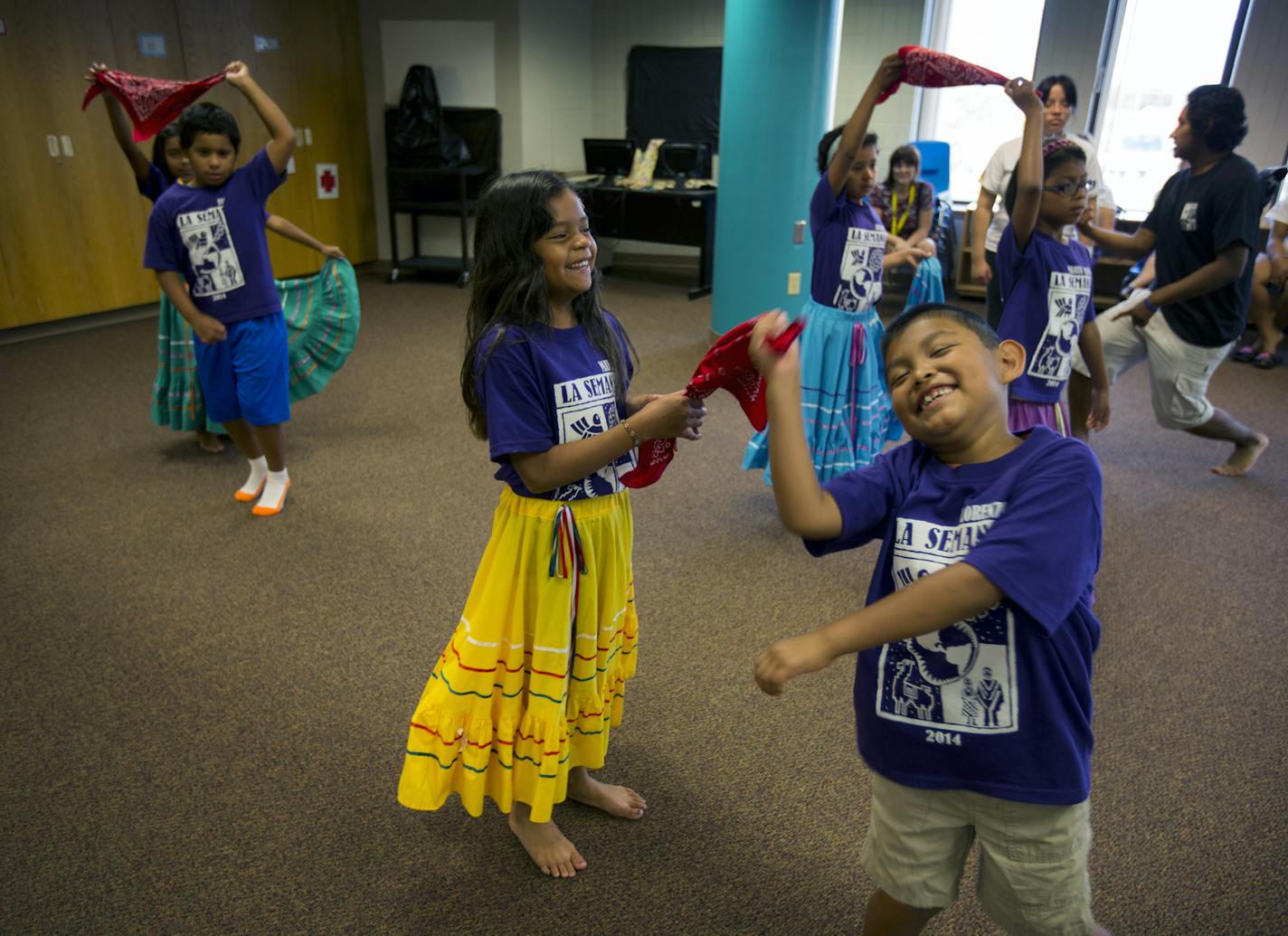 More than 450 children adopted from Latin America converged in the south metro last week (July 28-Aug. 1) for La Semana Culture Camp. The camp, now in its 33rd year, celebrates the campers' countries of origin. They learn dance, language, arts and crafts and form friendships with other kids who look like them. Here, Joey D'avignon (right) and Julia Tycast have fun practicing their traditional dance that will be performed this Friday. ] BRIAN PETERSON &#x201a;&#xc4;&#xa2; brian.peterson@startribu