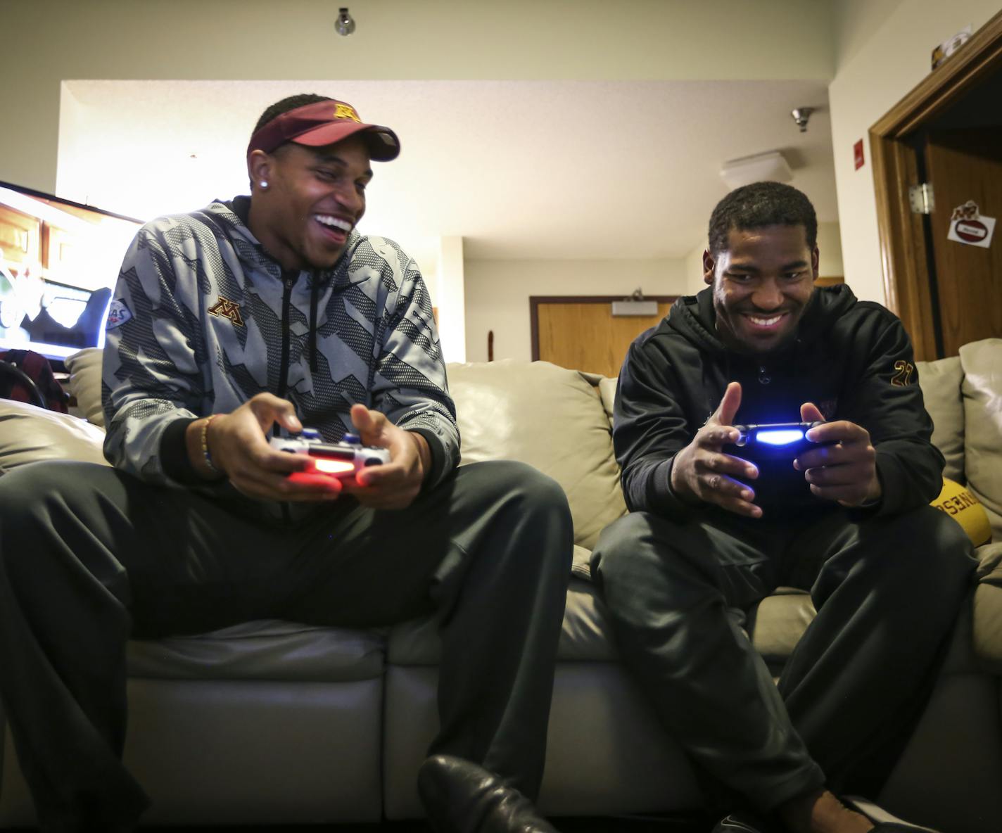 From the left; Cousins Damien Wilson and David Cobb are roommates and some of the Big Ten's most valuable running backs. They were photographed playing video games in their dorm on Thursday, October 2, 2014 in Minneapolis, Minn. ] RENEE JONES SCHNEIDER &#x2022; reneejones@startribune.com