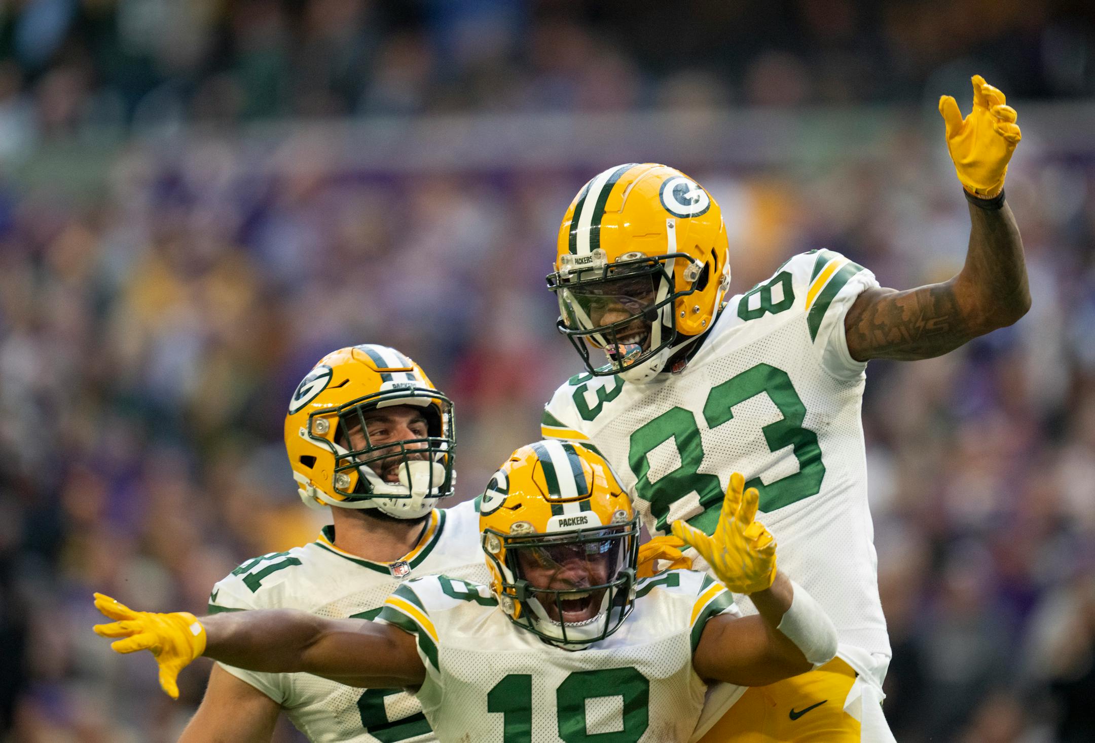 Green Bay Packers wide receiver Marquez Valdes-Scantling (83) celebrated with teammates Randall Cobb (18) and Josiah Deguara (81) after he caught a 65 yard touchdown pass late in the fourth quarter.