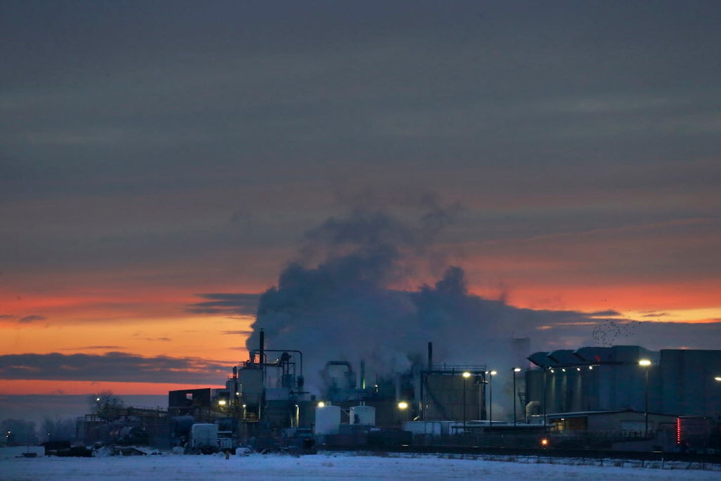 In this Jan. 11, 2016 file photo, dawn approaches over the meat processing plant owned and run by Cargill Meat Solutions, in Fort Morgan, a small town on the eastern plains of Colorado. The U.S. Equal Employment Commission said Friday, Sept. 14, 2018 that Cargill has agreed to pay $1.5 million to 138 Somali-American Muslim workers who were fired from the plant in 2016 after they were refused prayer breaks.