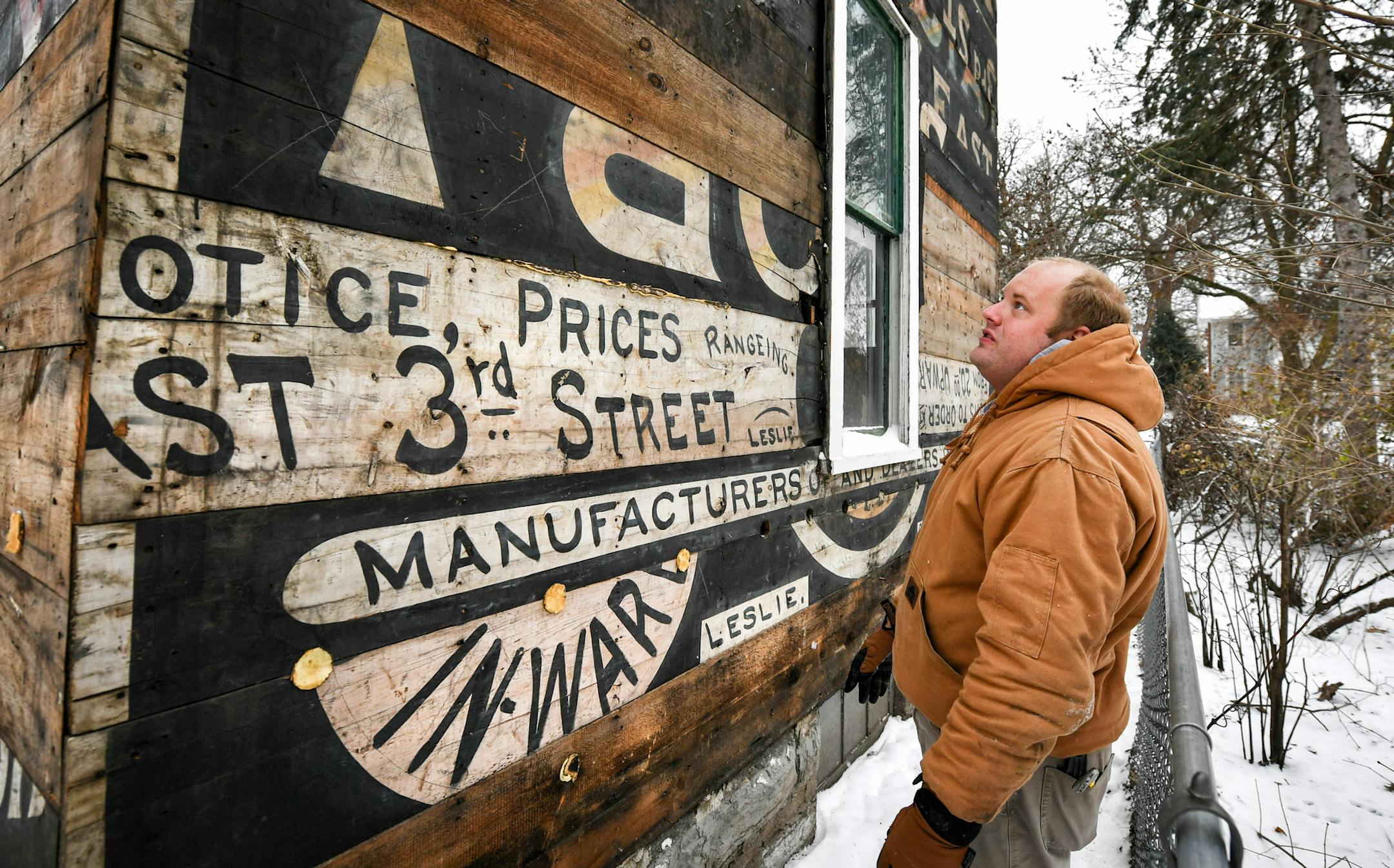 Boards likely from a 1870's era ice skating rink were used to build this St. Paul house. They were uncovered by the owner Todd Johnson during remodeling. ] GLEN STUBBE &#xa5; glen.stubbe@startribune.com Wednesday, December 6, 2017 Beneath the asbestos shingles, and beneath a layer of cedar shakes behind that, Todd Johnson found something unexpected covering his 1881 house: Old hand-painted signs. It seems that boards that were painted signs on even older buildings were recycled when Johnson's Ho